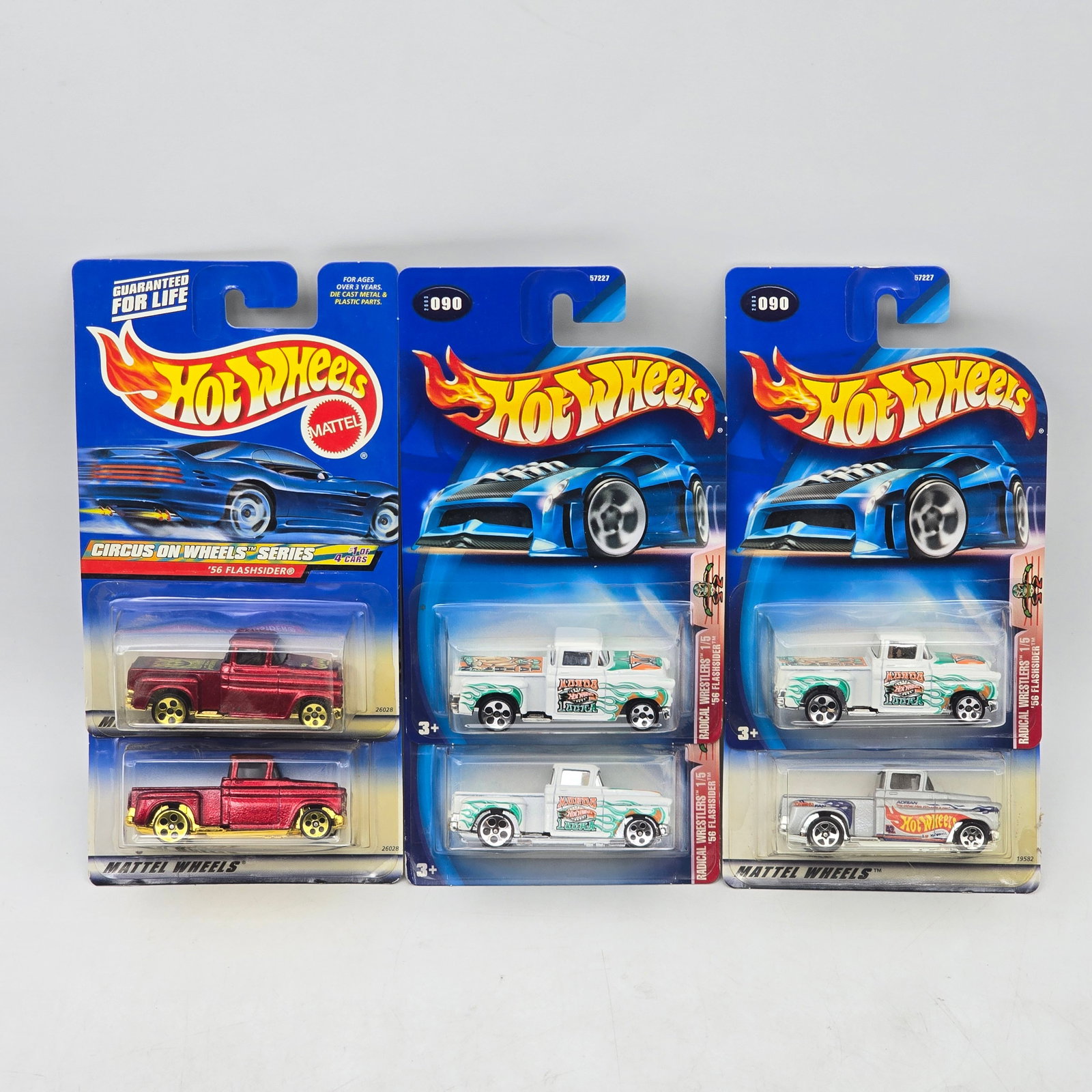 Lot Of 6 Hot Wheels Flashsider Trucks: Lot of 6 Hot Wheels diecast Flashsider truck castings. Includes multiple examples in varied colors and deco, with both classic and custom-style presentations. All items are unopened in original bliste