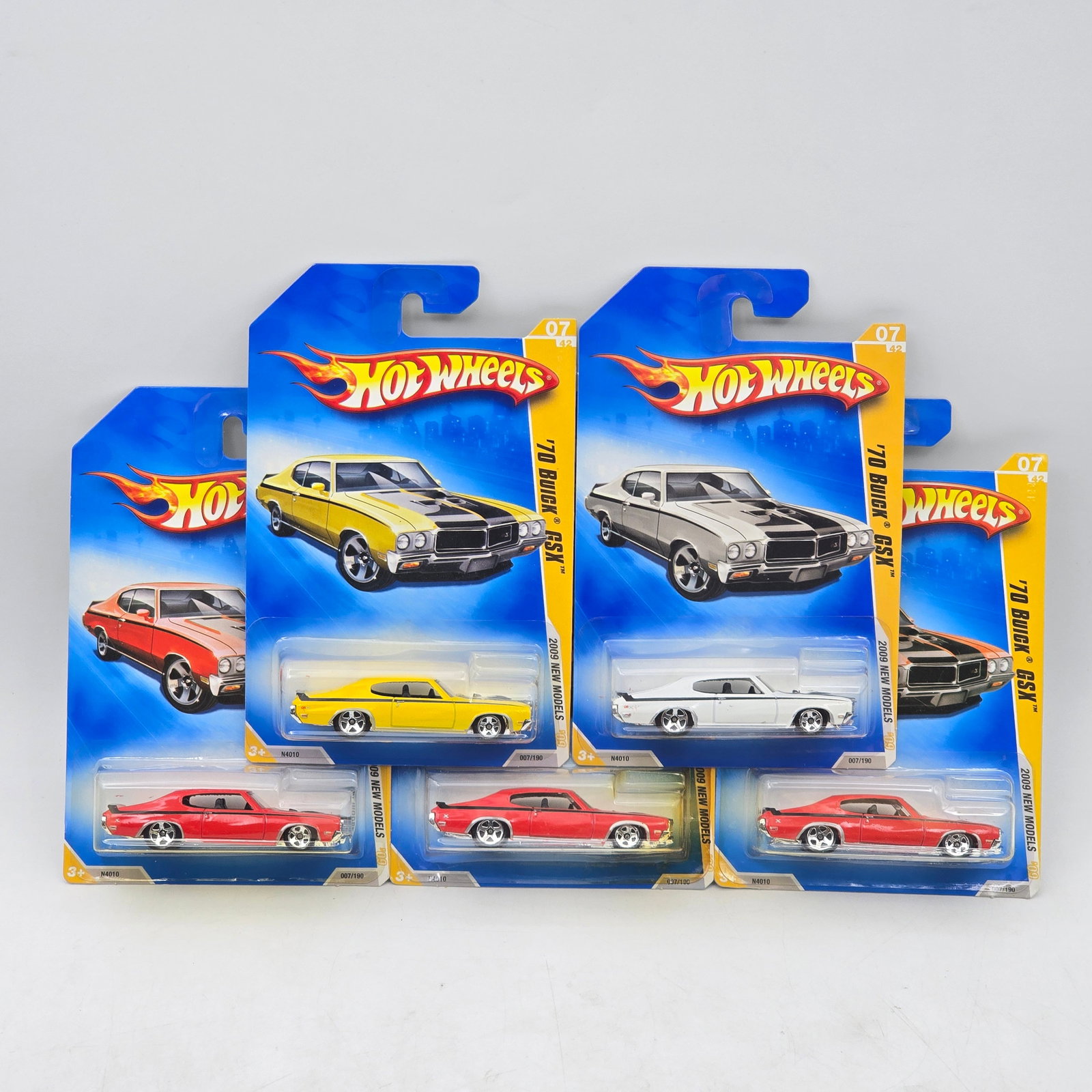 Lot Of 5 Hot Wheels Buick GSX Models: Lot of 5 Hot Wheels diecast Buick GSX castings. Includes multiple examples in yellow, white, and red, showcasing this classic muscle car in varied factory-style colors. All items are unopened in origi