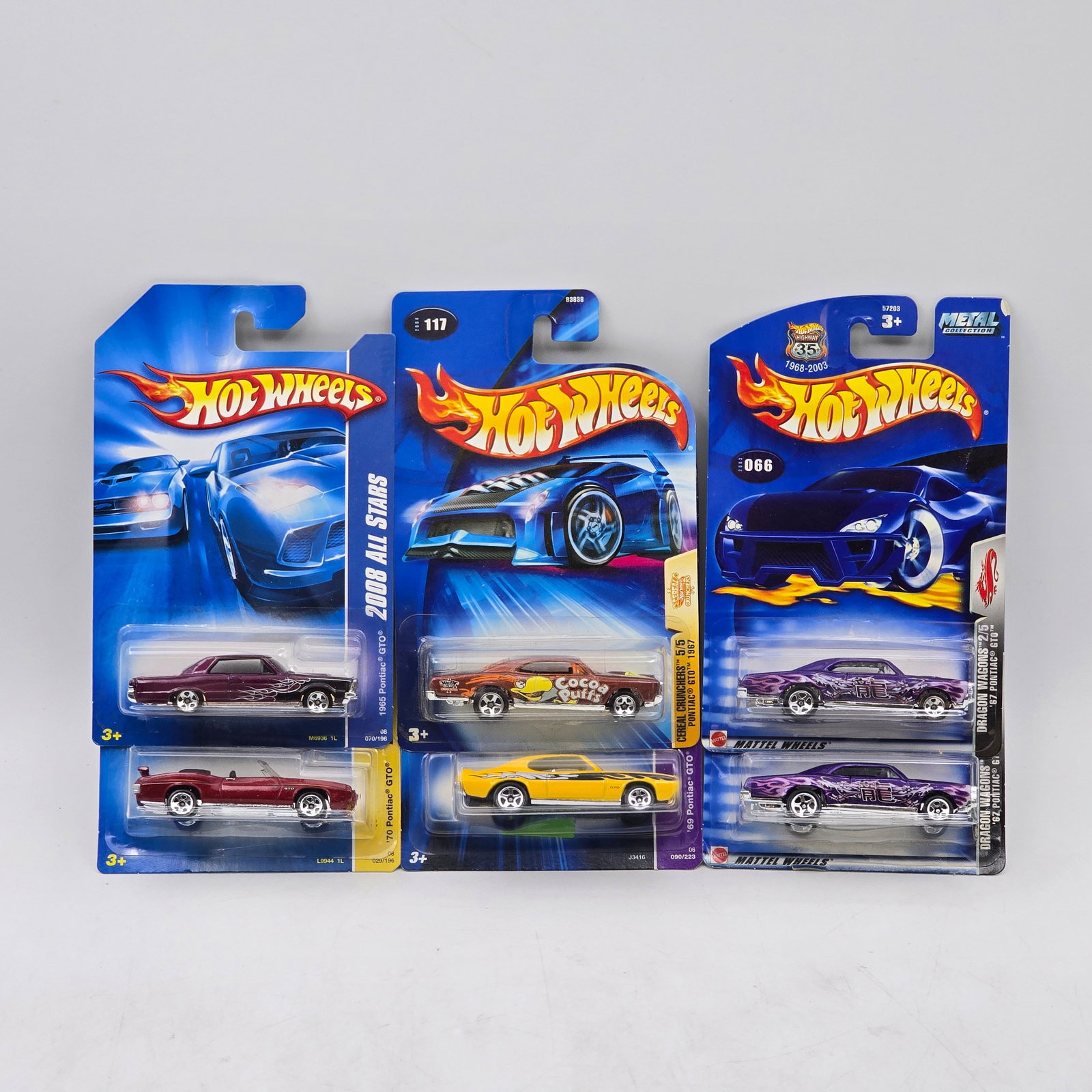 Lot Of 6 Hot Wheels Pontiac Models: Lot of 6 Hot Wheels diecast Pontiac castings. Includes GTO and Firebird-style models with a mix of muscle-era designs, featuring both clean factory finishes and graphic deco examples. All items are un