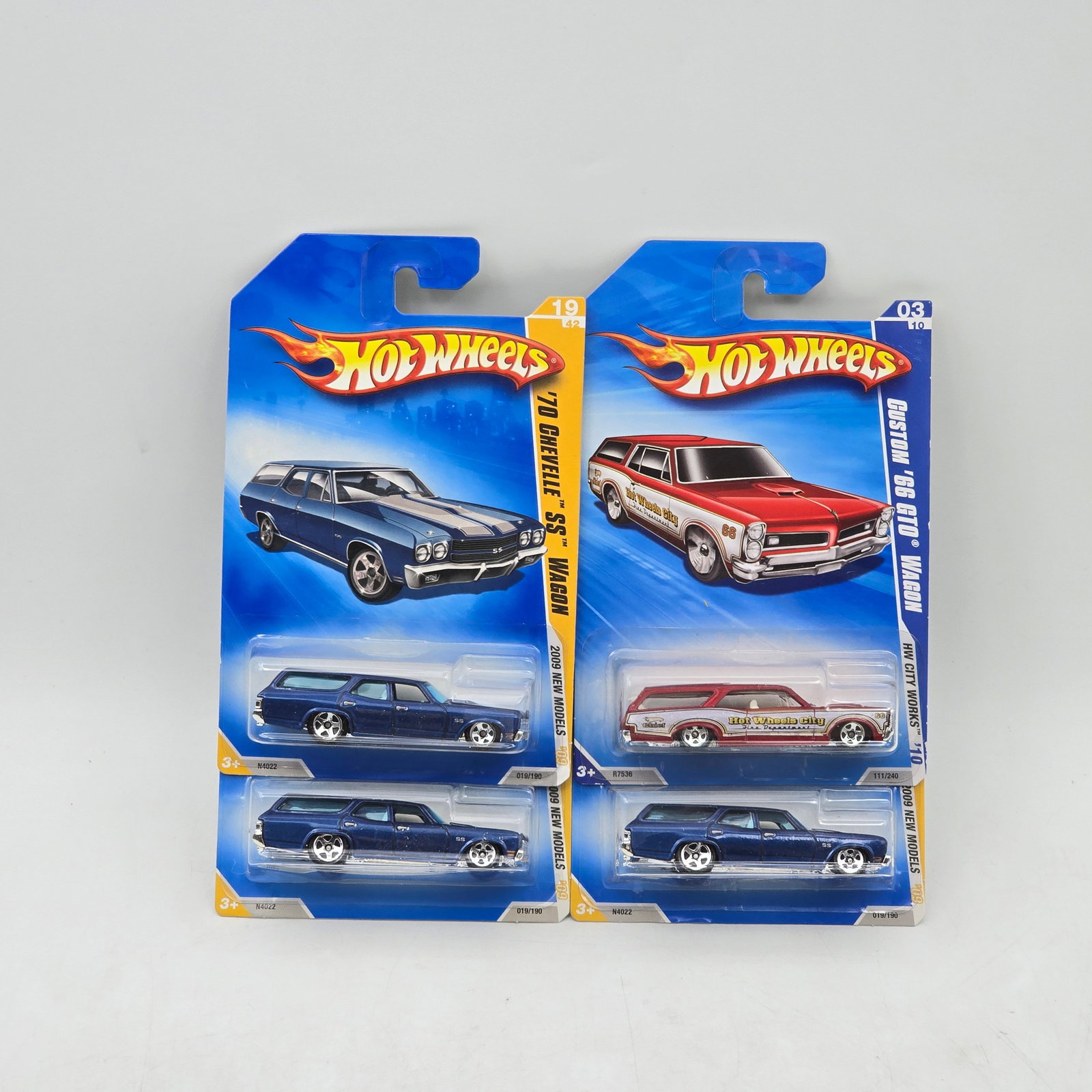 Lot Of 4 Hot Wheels Wagon Models: Lot of 4 Hot Wheels diecast wagon castings. Includes â€™70 Chevelle SS Wagon and Custom â€™66 GTO Wagon models in blue and red, featuring classic long-roof styling. All items are unope