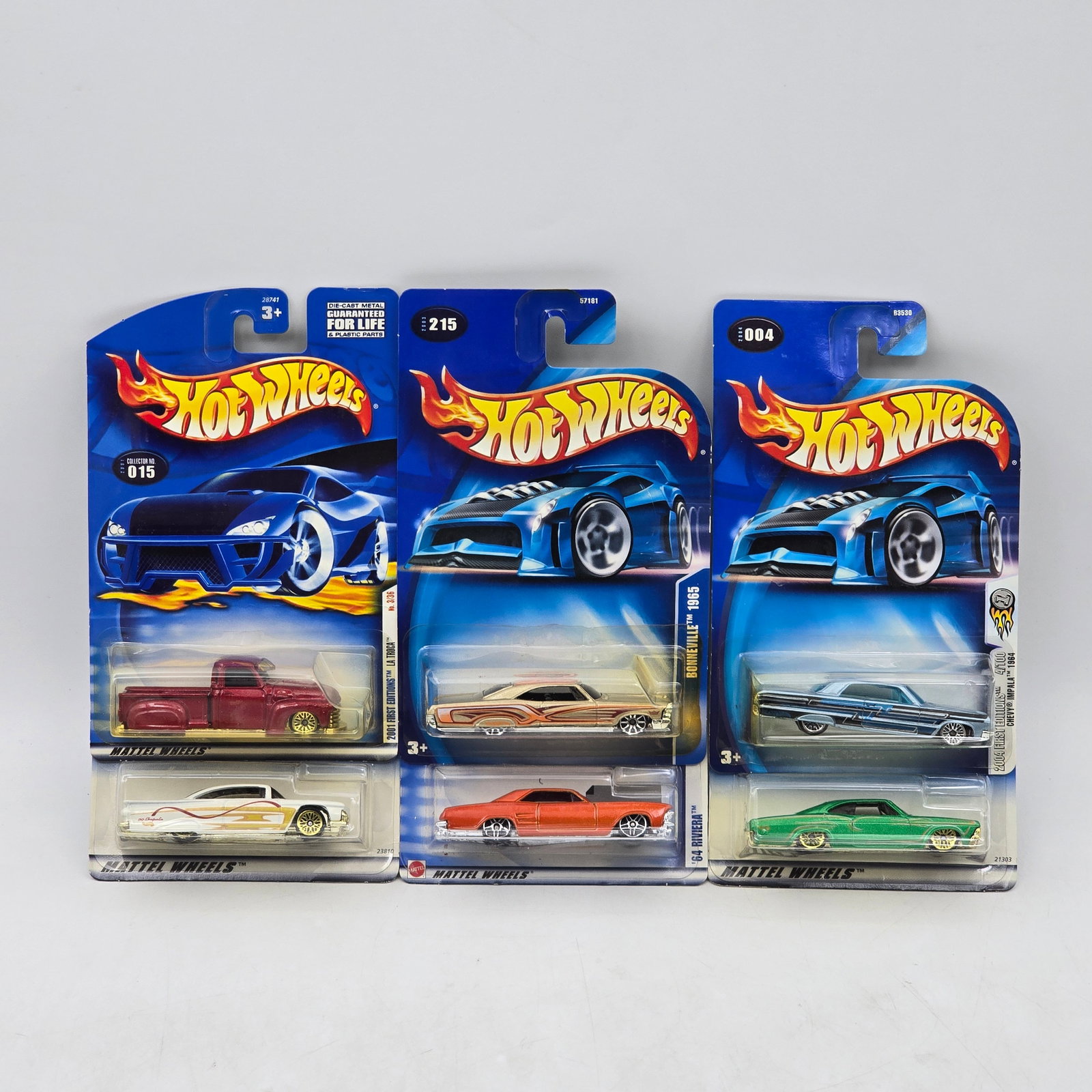 Lot Of 6 Hot Wheels Lowrider-Style Models: Lot of 6 Hot Wheels diecast vehicles featuring lowrider-style and custom cruiser castings. Includes classic cars and a custom pickup with low-slung stances, detailed striping, and period-inspired grap