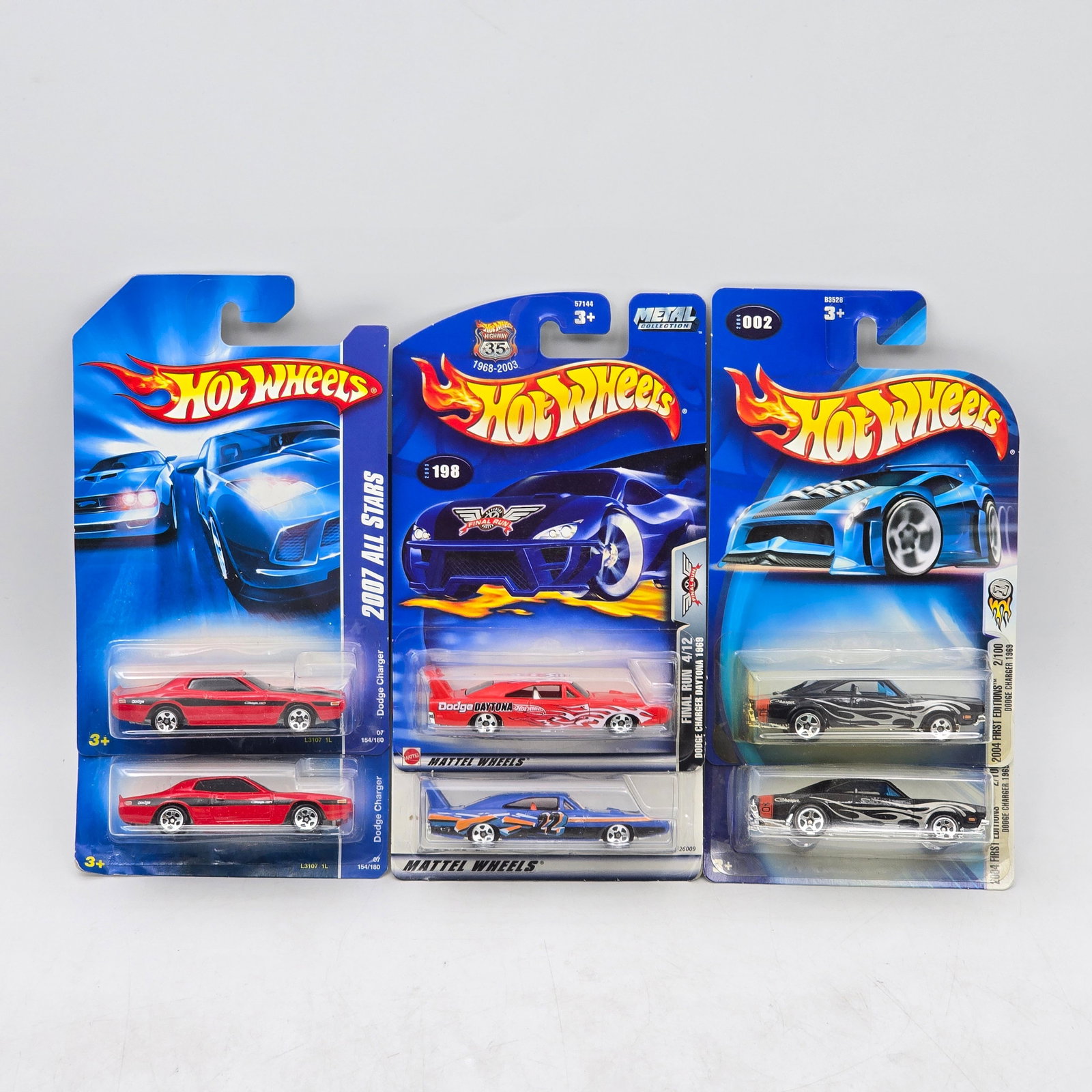 Lot Of 6 Hot Wheels Dodge Castings: Lot of 6 Hot Wheels diecast Dodge models. Includes Charger and Daytona-style muscle cars along with custom Dodge drag and performance builds in red, blue, and black with varied graphic deco. All items