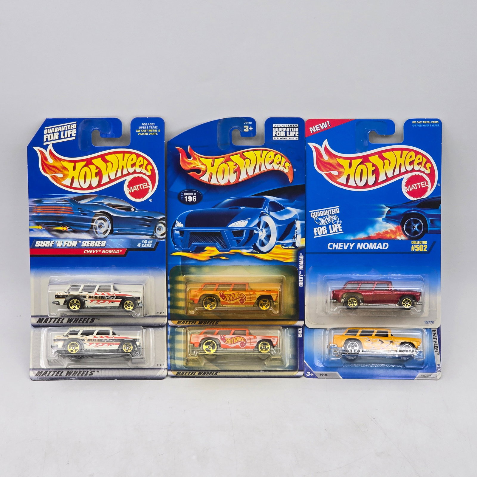 Lot Of 6 Hot Wheels Chevy Nomad Models: Lot of 6 Hot Wheels diecast Chevy Nomad castings. Includes multiple examples in white, gold, red, and yellow, featuring both clean factory finishes and surf/racing-style graphics. All items are unopen