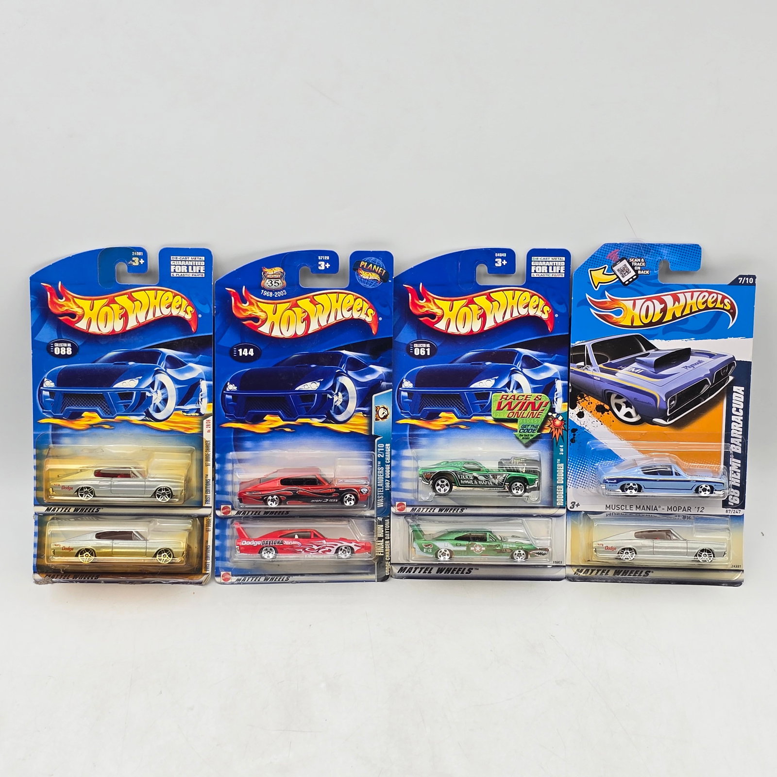 Lot Of 8 Hot Wheels Muscle Car Models: Lot of 8 Hot Wheels diecast vehicles featuring muscle car castings. Includes a mix of Mopar and classic American performance designs such as Barracuda and similar models, in silver, red, and green wit
