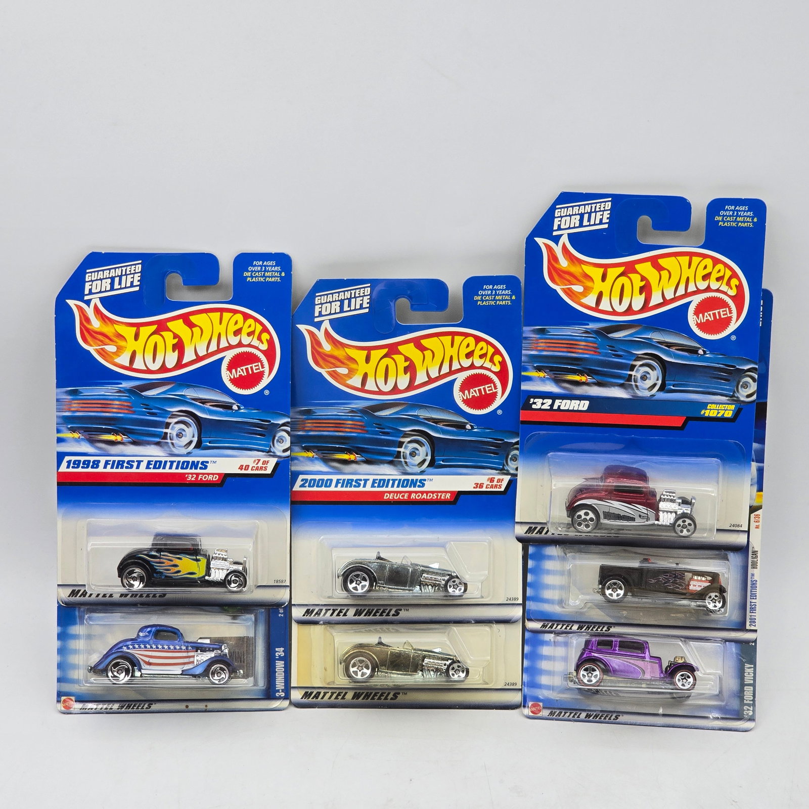 Lot Of 7 Hot Wheels Hot Rod & Vintage Models: Lot of 7 Hot Wheels diecast vehicles featuring hot rod and vintage-style castings. Includes â€™32 Ford and other classic roadsters and coupes with a mix of clean finishes and patriotic/flame-s