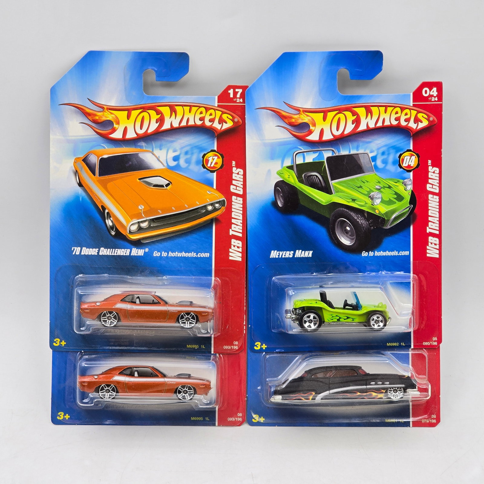 Lot Of 4 Hot Wheels Performance & Custom Models: Lot of 4 Hot Wheels diecast vehicles featuring a mix of performance and custom castings. Includes â€™70 Dodge Challenger R/T, Meyers Manx, and additional custom car designs in orange, green, a