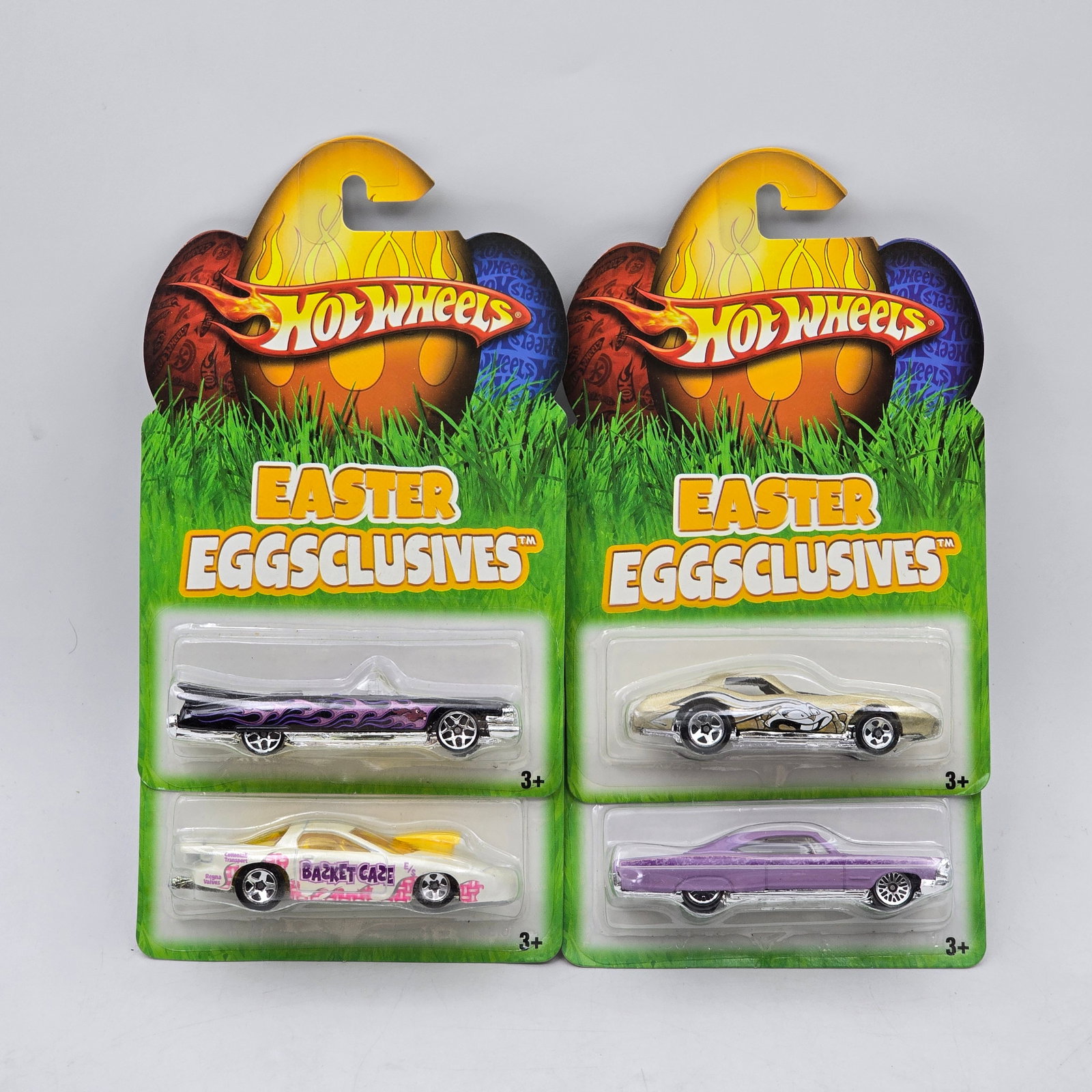 Lot Of 4 Hot Wheels Easter Eggsclusives Models: Lot of 4 Hot Wheels diecast vehicles from the Easter Eggsclusives series. Includes themed castings in pastel and custom finishes, with seasonal packaging unique to this release. All items are unopened