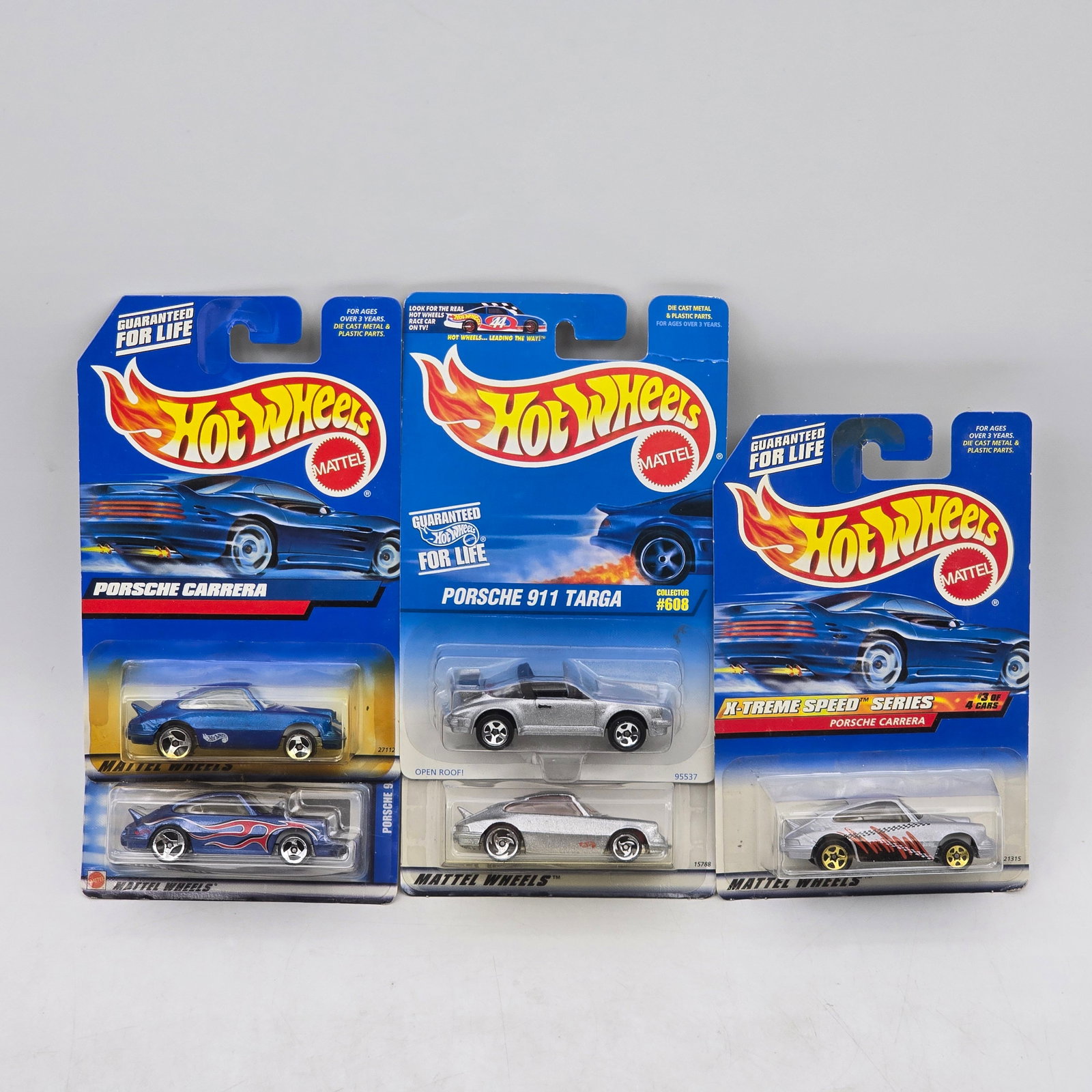 Lot Of 5 Hot Wheels Porsche Models: Lot of 5 Hot Wheels diecast Porsche castings. Includes Porsche Carrera and Porsche 911 Targa models in blue, silver, and custom graphic variations with flame and racing-style deco. All items are unope
