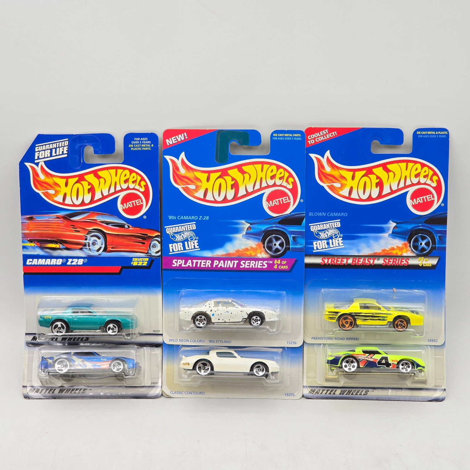 Lot Of 5 Hot Wheels Camaro Models: Lot of 5 Hot Wheels diecast Camaro castings. Includes â€™80s Camaro Z28 along with custom and Street Beast-style Camaro variations in teal, white, and yellow with a mix of clean finishes and g