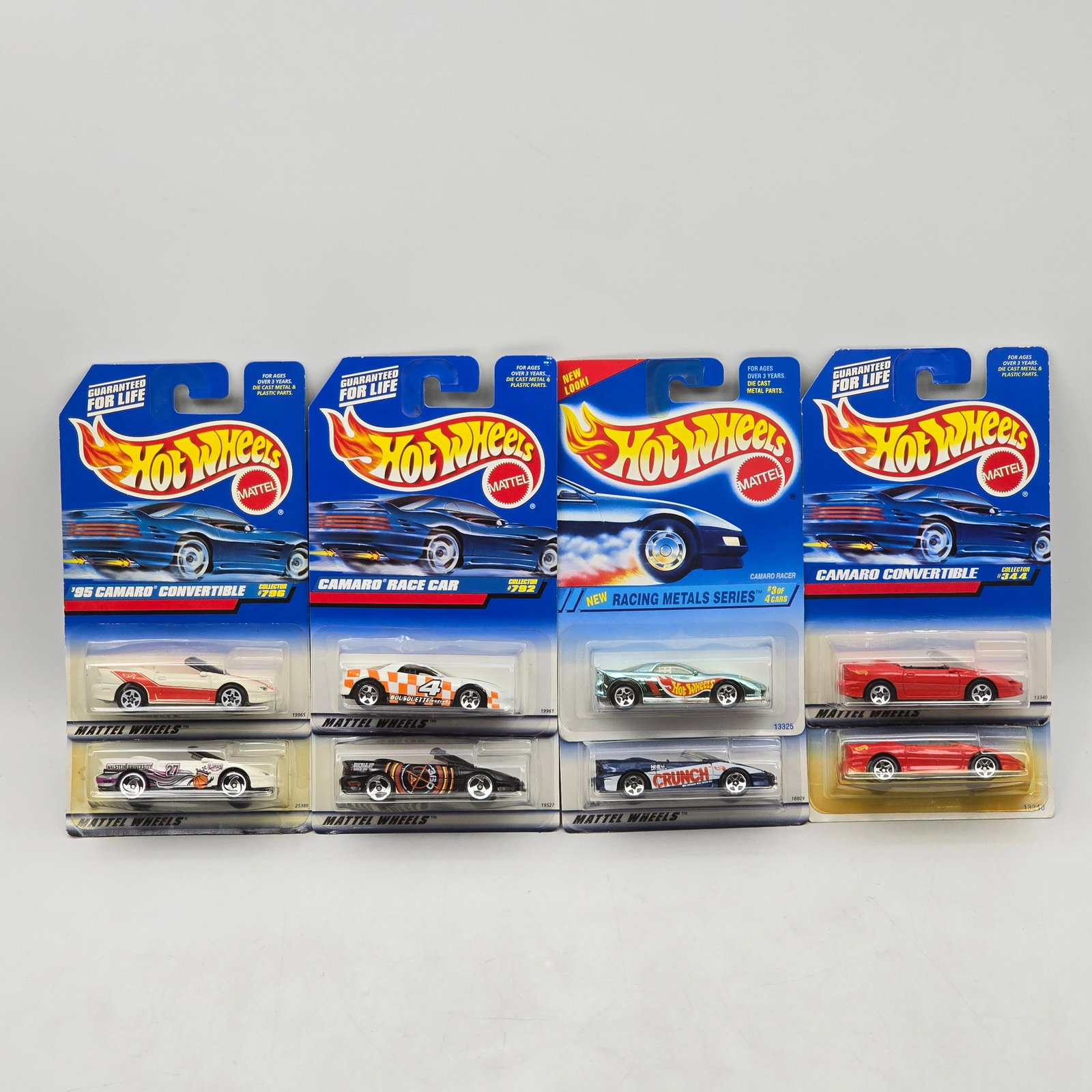 Lot Of 8 Hot Wheels Camaro Models: Lot of 8 Hot Wheels diecast Camaro castings. Includes â€™95 Camaro Convertible, Camaro Race Car, and additional Camaro variants in white, red, black, and multi-color racing deco, including Rac
