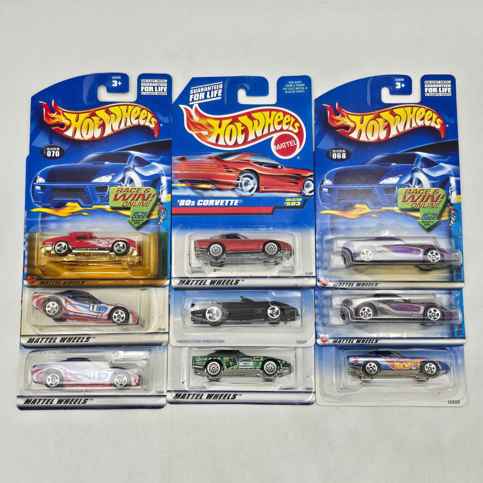 Lot Of 9 Hot Wheels Corvette Models: Lot of 9 Hot Wheels diecast Corvette castings. Includes â€™80s Corvette along with additional Corvette variants in red, white, black, and purple featuring a mix of clean finishes and racing-st