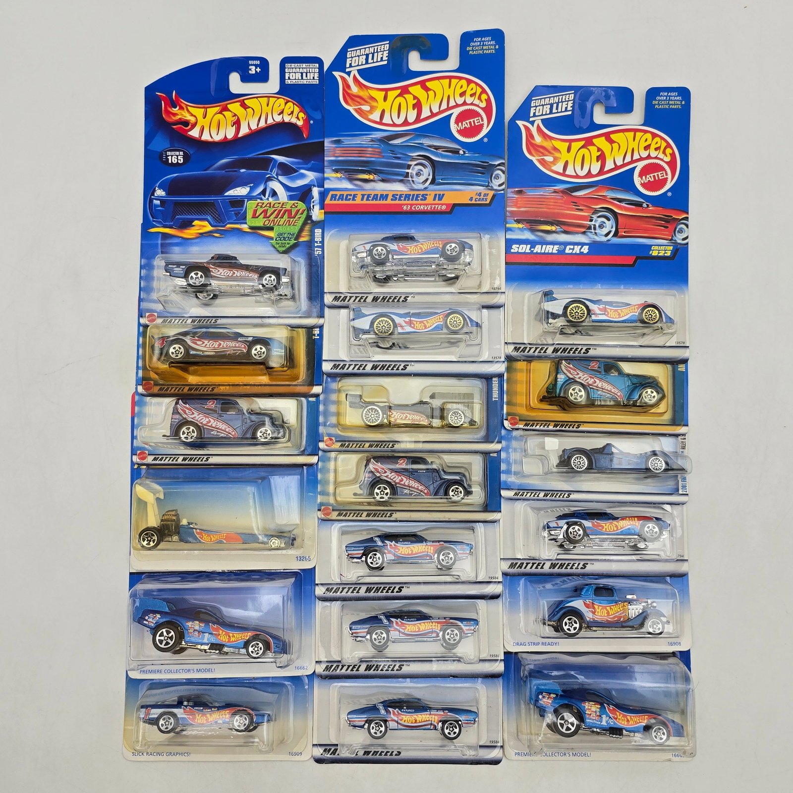 Lot Of 19 Hot Wheels Race Team Models: Lot of 19 Hot Wheels diecast vehicles featuring the classic Race Team livery. Includes a wide variety of castings such as â€™63 Corvette, Sol-Aire CX4, dragsters, and custom racers, all in the