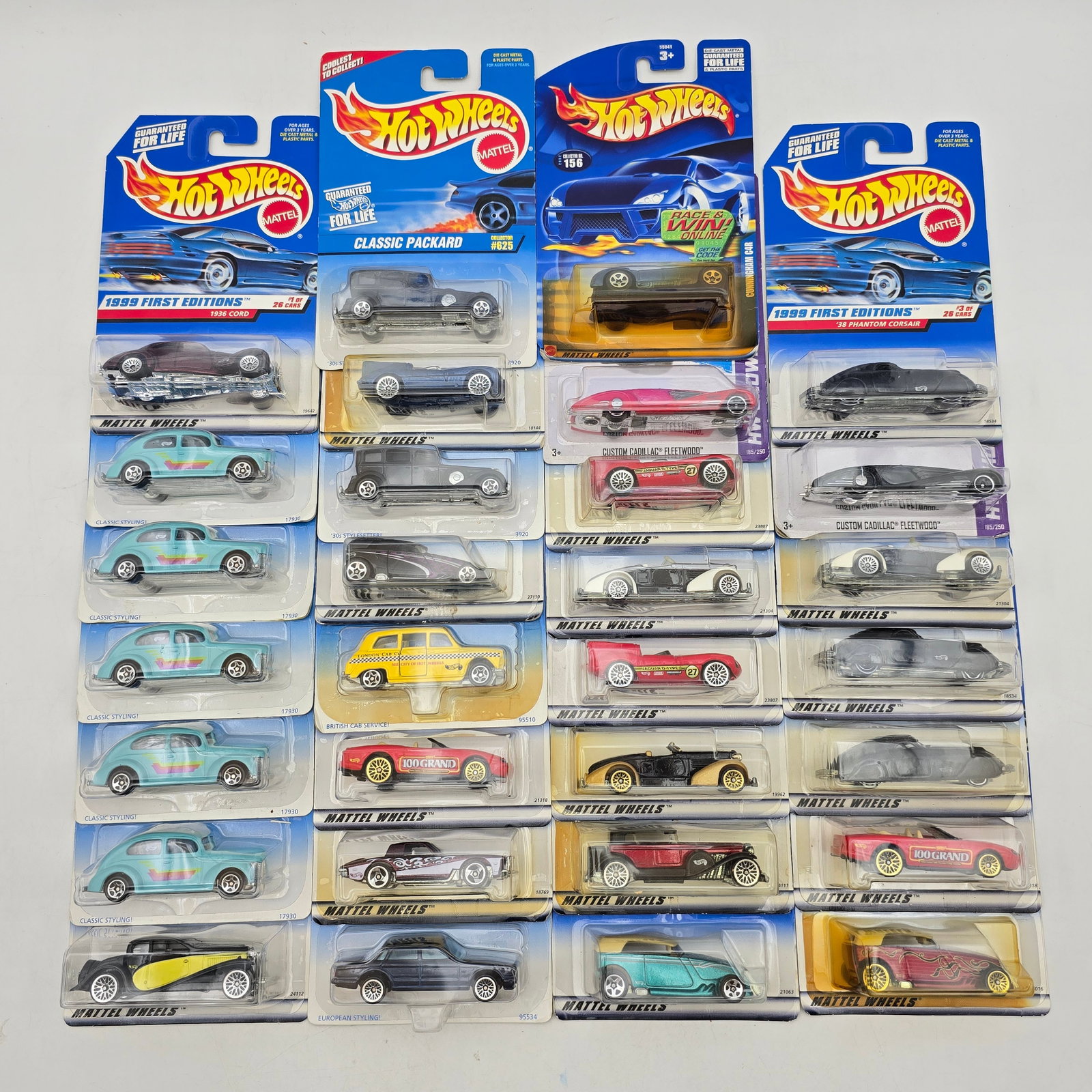 Lot Of 30 Hot Wheels Diecast Vehicles: Large lot of 30 Hot Wheels diecast models featuring a wide variety of castings. Includes a mix of classic cars, hot rods, concept vehicles, and custom builds in assorted colors and graphic styles, wit