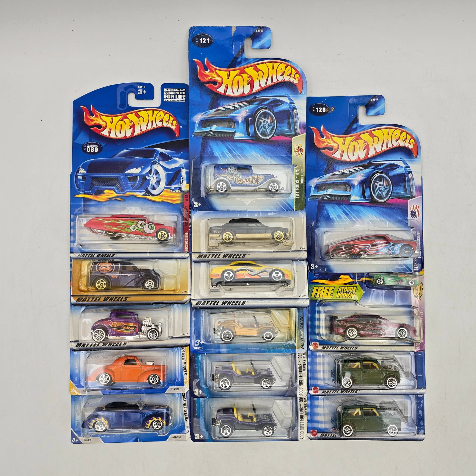 Lot Of 15 Hot Wheels Models: Lot of 15 Hot Wheels diecast vehicles featuring a wide mix of castings. Includes compact cars, custom builds, fantasy models, and performance-style vehicles in assorted colors and graphic variations. 