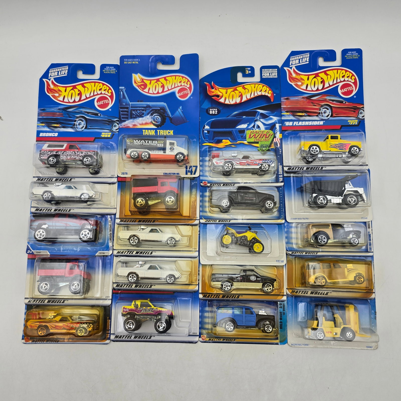 Lot Of 20 Hot Wheels Mixed Models: Lot of 20 Hot Wheels diecast vehicles featuring a broad mix of castings. Includes cars, trucks, utility vehicles, and custom builds in a variety of colors and graphic styles, with both realistic and f