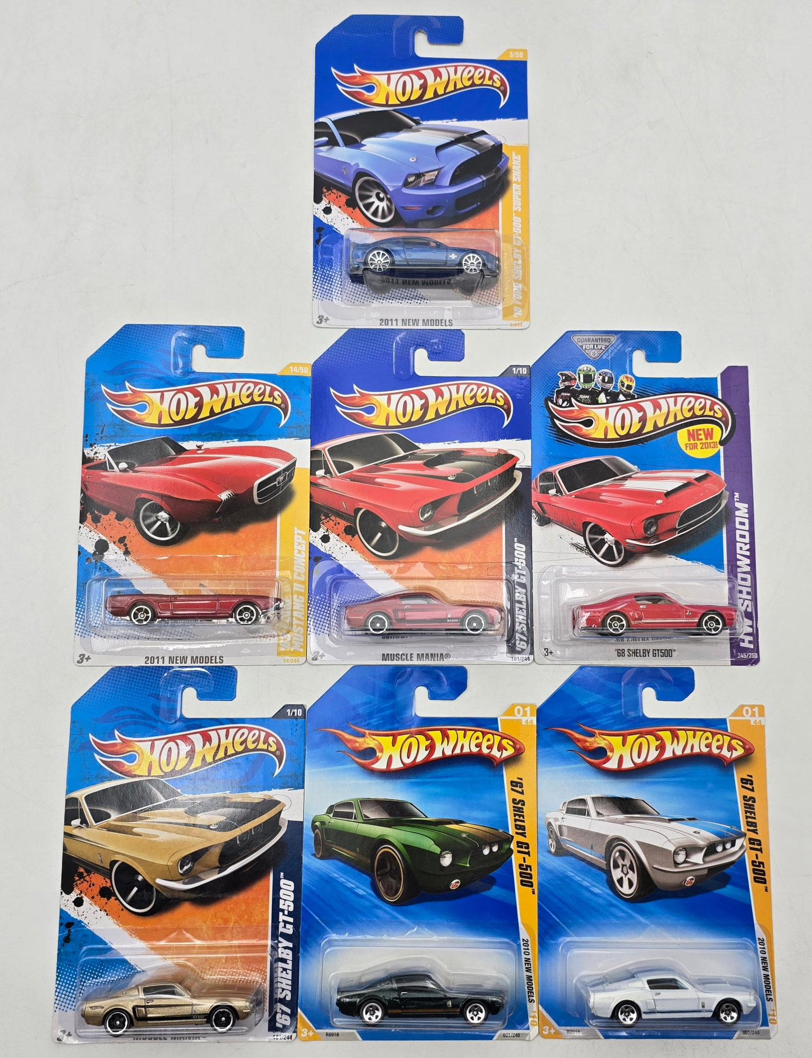 Lot of 7 Hot Wheels Shelby Variations: Group of 7 Hot Wheels diecast Shelby and Ford performance castings from early 2010s releases, featuring multiple Shelby GT-500 and custom Mustang-inspired models in assorted colors. Includes muscle-er