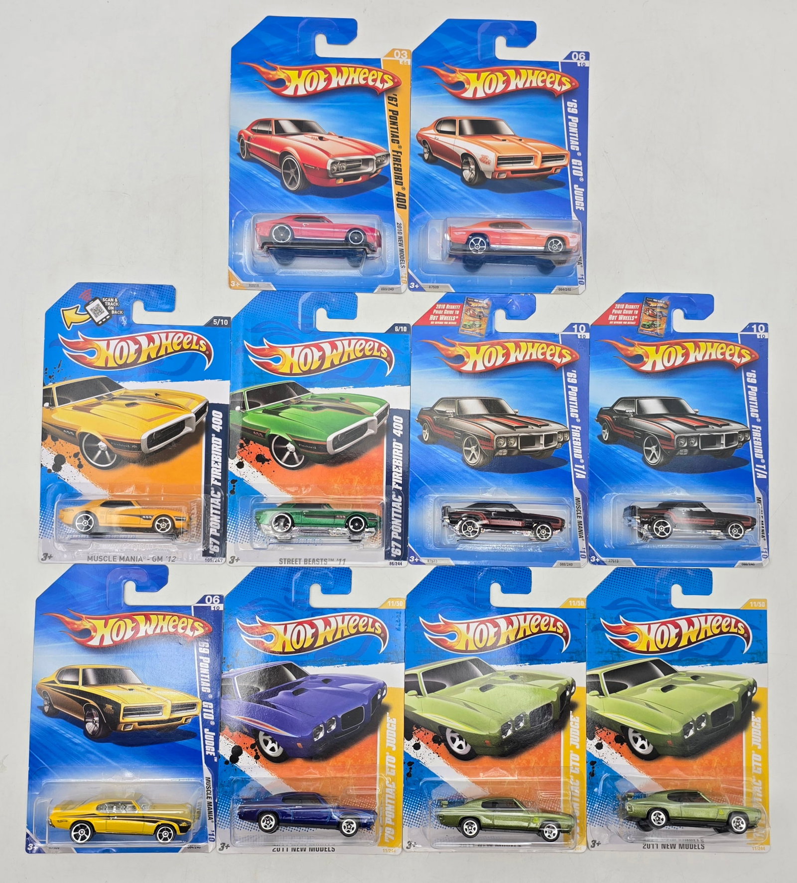 Lot of 10 Hot Wheels Pontiac Muscle Cars: Group of 10 Hot Wheels diecast Pontiac castings from early 2010s releases, featuring multiple GTO Judge, Firebird 400, and â€™69 Pontiac Firebird variations in assorted colorways and series re