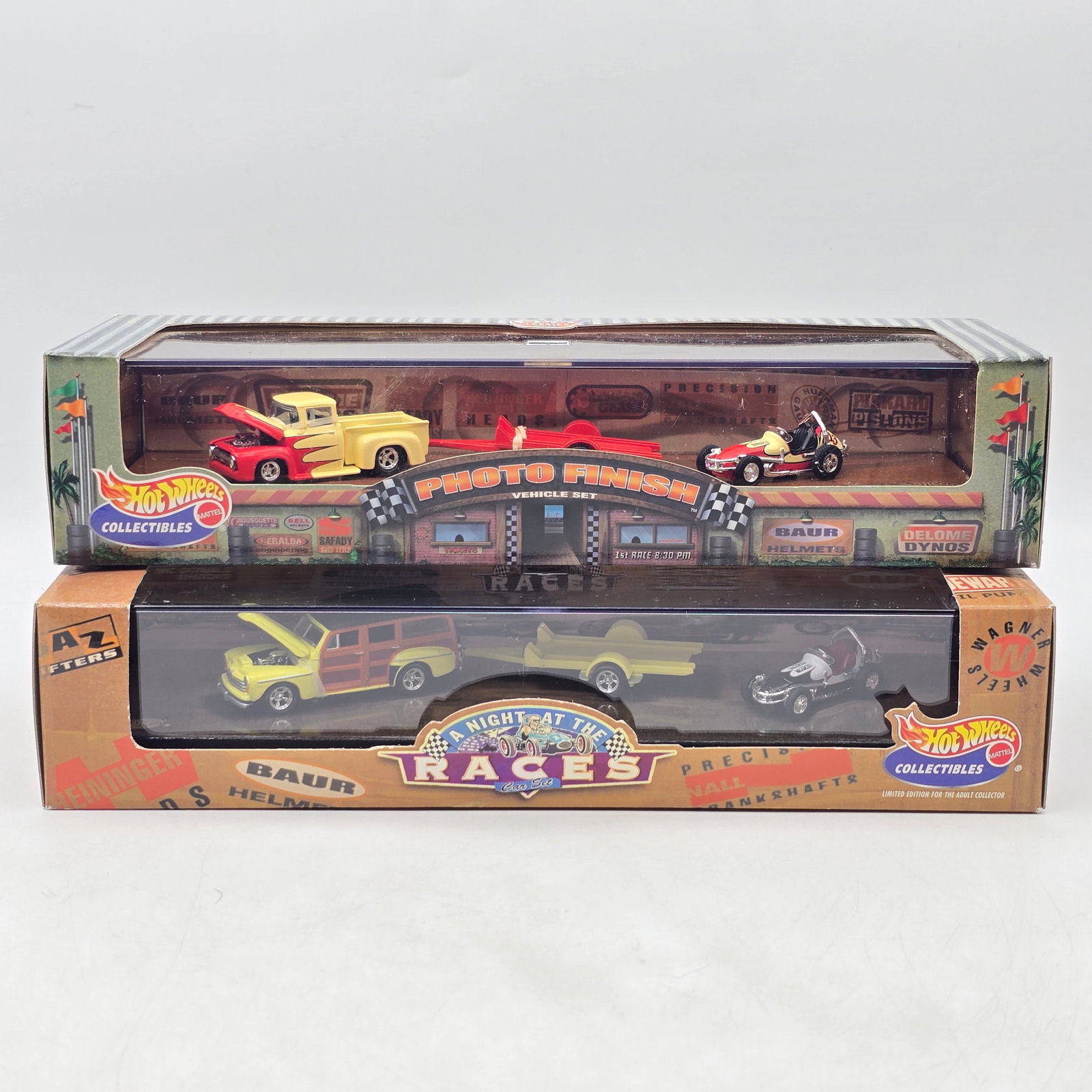 Pair of Hot Wheels Collectibles Gift Sets: Pair of Hot Wheels Collectibles multi-vehicle gift sets from the â€?A Night at the Racesâ€? series, featuring themed race support vehicles, trailers, and dragster-style race cars. Includes