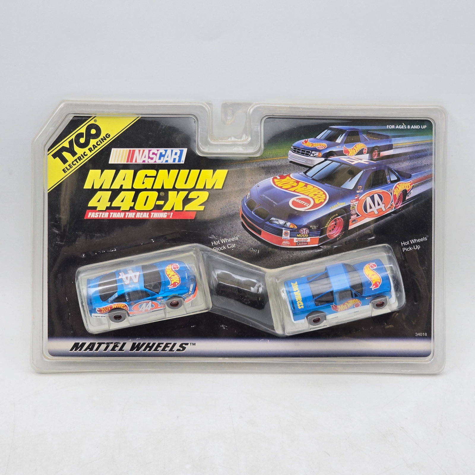 Hot Wheels Tyco Magnum 440-X2 Slot Set: Hot Wheels and Tyco Electric Racing collaboration H.O. scale slot car set, produced circa late 1990s. This NASCAR-themed Magnum 440-X2 release includes a pair of Hot Wheels-decorated slot vehicles fea