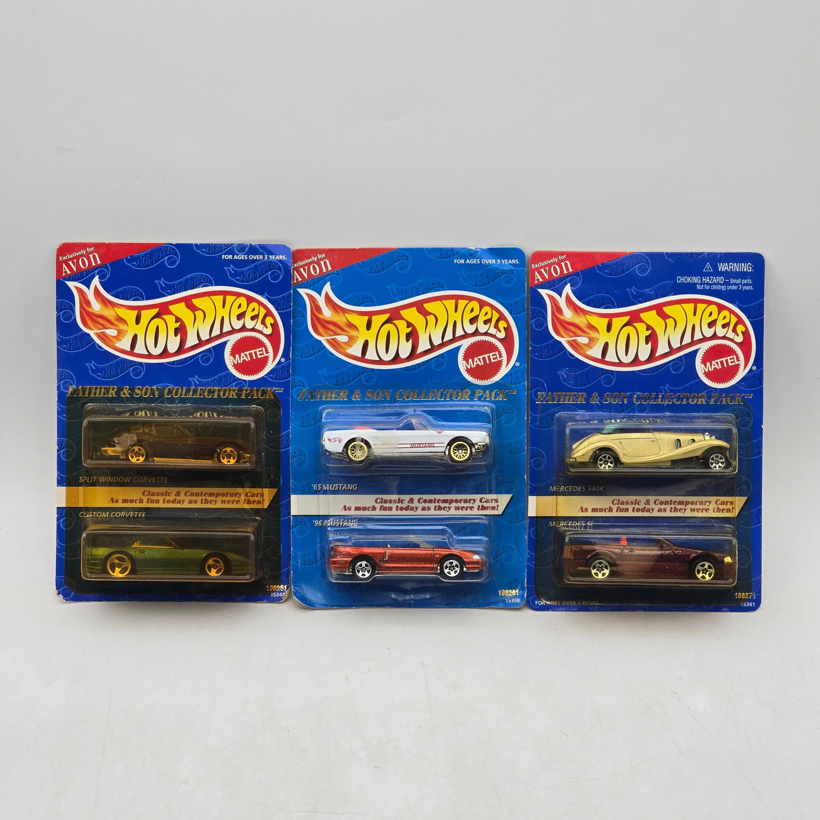 Lot of 3 Avon Hot Wheels 2-Packs: Group of 3 Avon exclusive Hot Wheels Father & Son Collector Pack releases, produced circa late 1990s. These themed 2-pack sets pair classic and contemporary vehicle castings, including Corvette, M