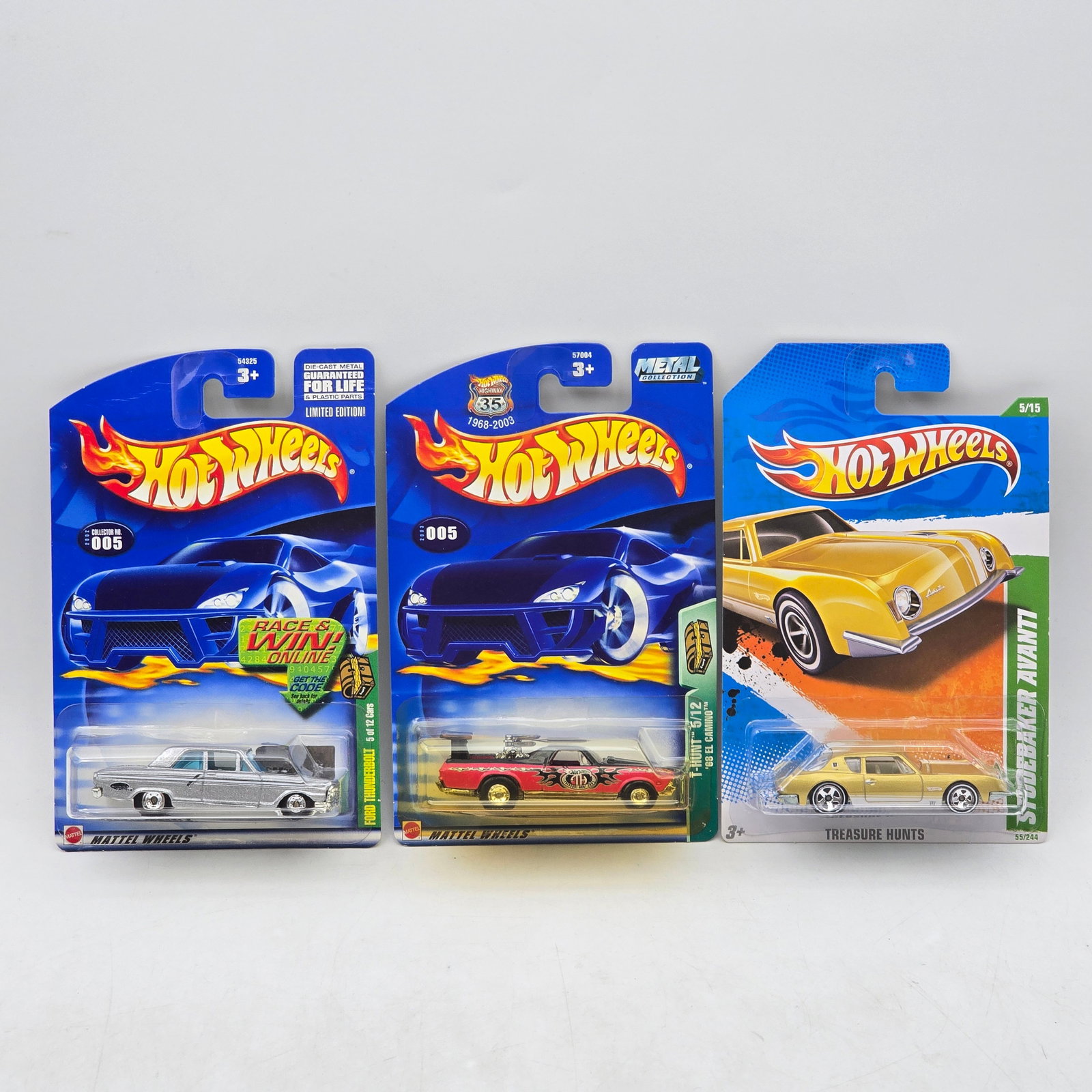 Lot of 3 Hot Wheels Treasure Hunts: Group of 3 Hot Wheels Treasure Hunts series releases, produced circa mid-2000s. This assortment includes collectible Treasure Hunt models from the 2005 and 2007 era featuring special series markings, 