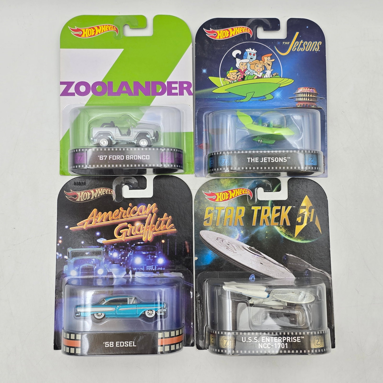 Lot of 4 Hot Wheels Retro Entertainment: Group of 4 Hot Wheels Retro Entertainment series releases, produced circa 2013â€“2015. This pop culture-themed assortment includes vehicles tied to Zoolander, The Jetsons, American Graffiti,