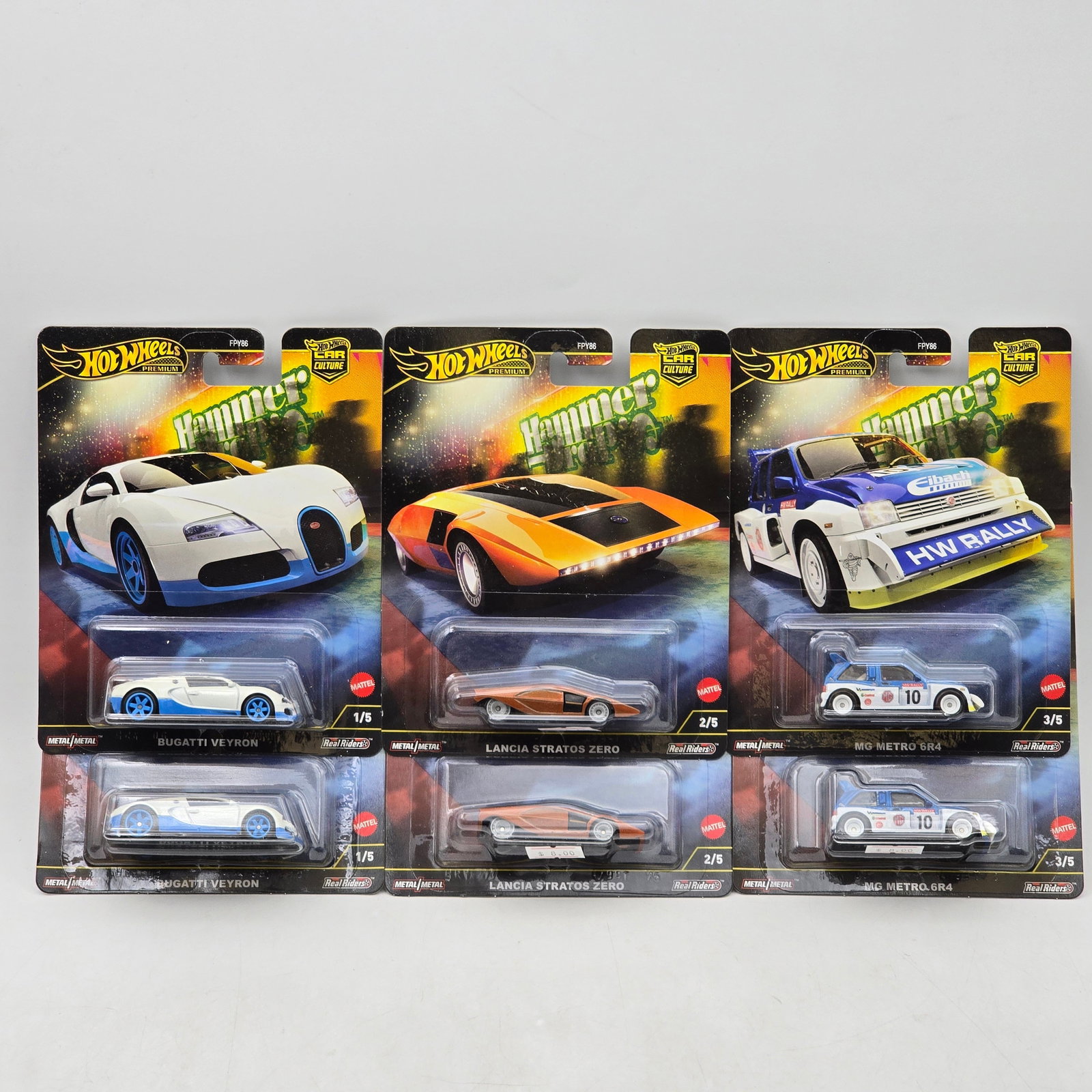 Lot of 6 Hot Wheels Hammer Drop Premiums: Includes pairs of Bugatti Veyron, Lancia Stratos Zero, and MG Metro 6R4 premium models from the Car Culture Hammer Drop series. Cars-Look to be in good condition with no notable wear visible. Paint,