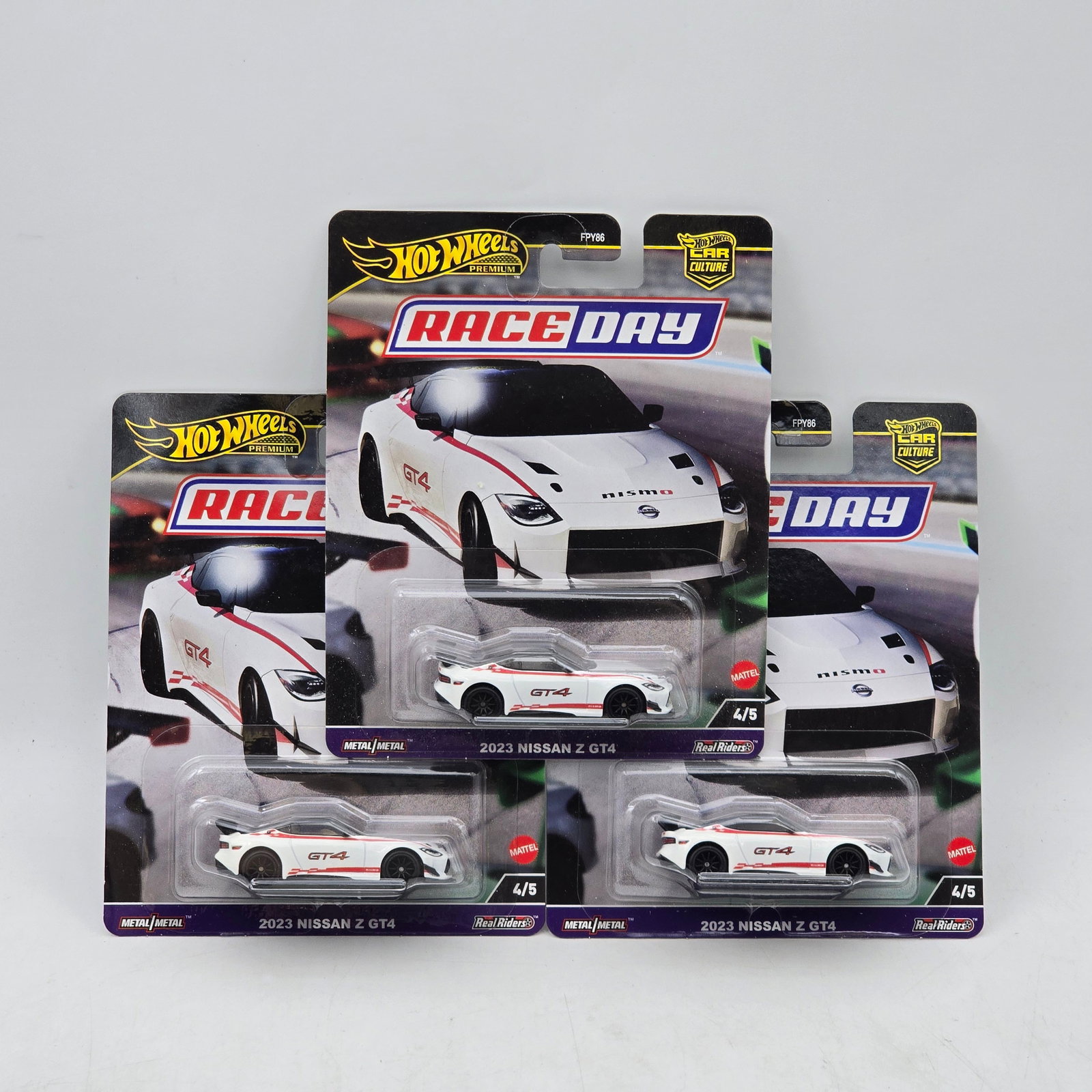 Lot of 3 Hot Wheels Race Day Premiums: Includes (3) 2023 Nissan Z GT4 premium models from the Car Culture Race Day series. Cars-Appear to be in good condition with clean paint, sharp tampo detail, and no obvious wear visible. Cards-Show