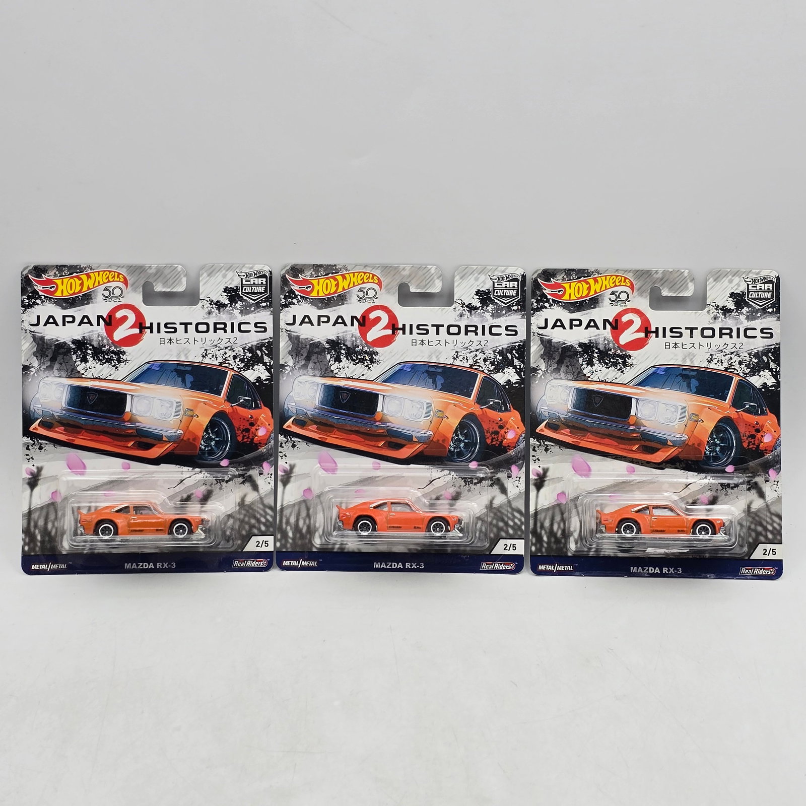 Lot of 3 Hot Wheels Japan Historics 2 Premiums: Includes (3) Mazda RX-3 premium models from the Car Culture Japan Historics 2 series. Cars-Appear to be in good condition with clean paint, sharp tampo detail, and no obvious wear visible. Cards-Show 