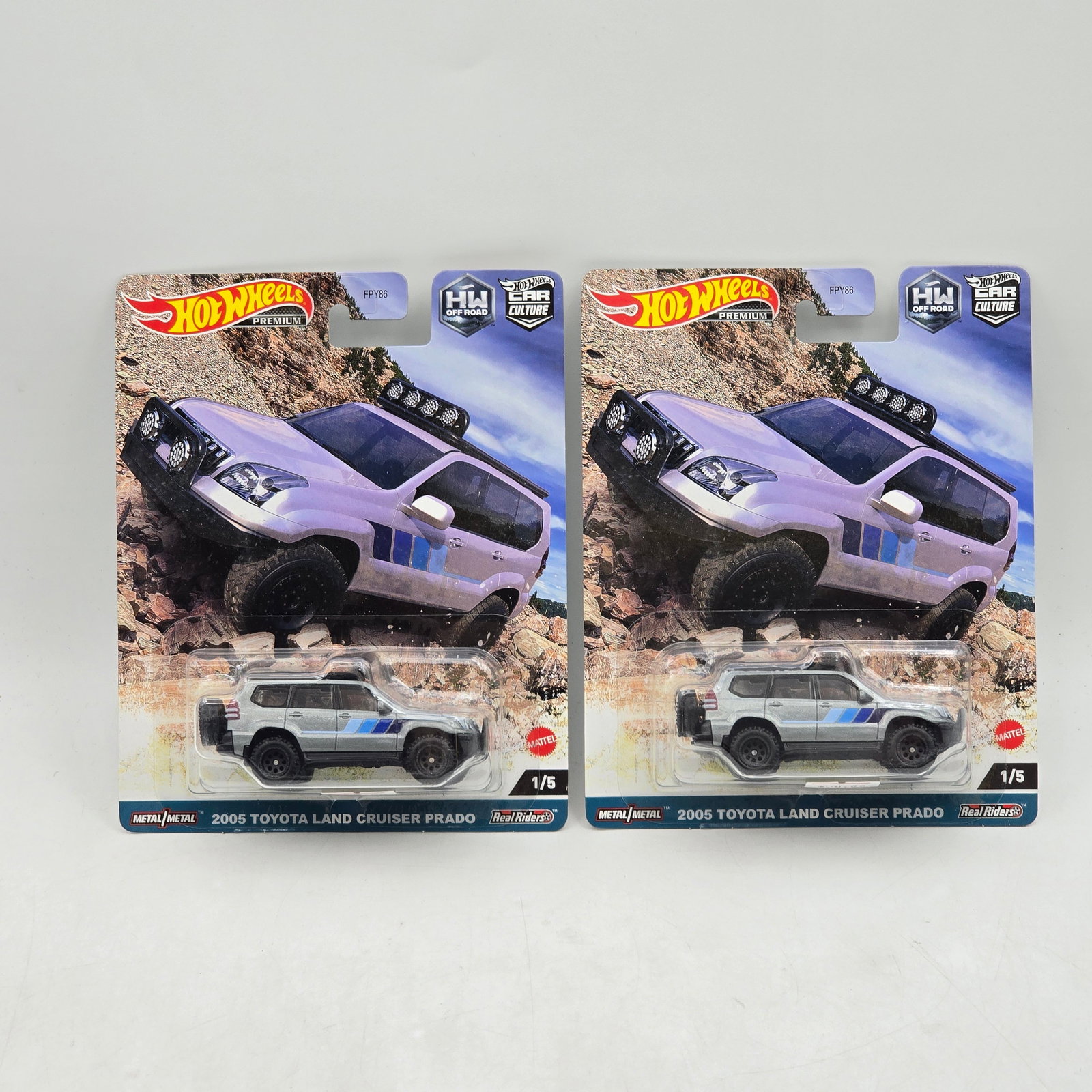 Pair of Hot Wheels Off Road Premiums: Includes (2) 2005 Toyota Land Cruiser Prado premium models from the Car Culture HW Off Road series. Cars-Look to be in good condition with no notable wear visible. Paint, tampos, glass, base and Real 