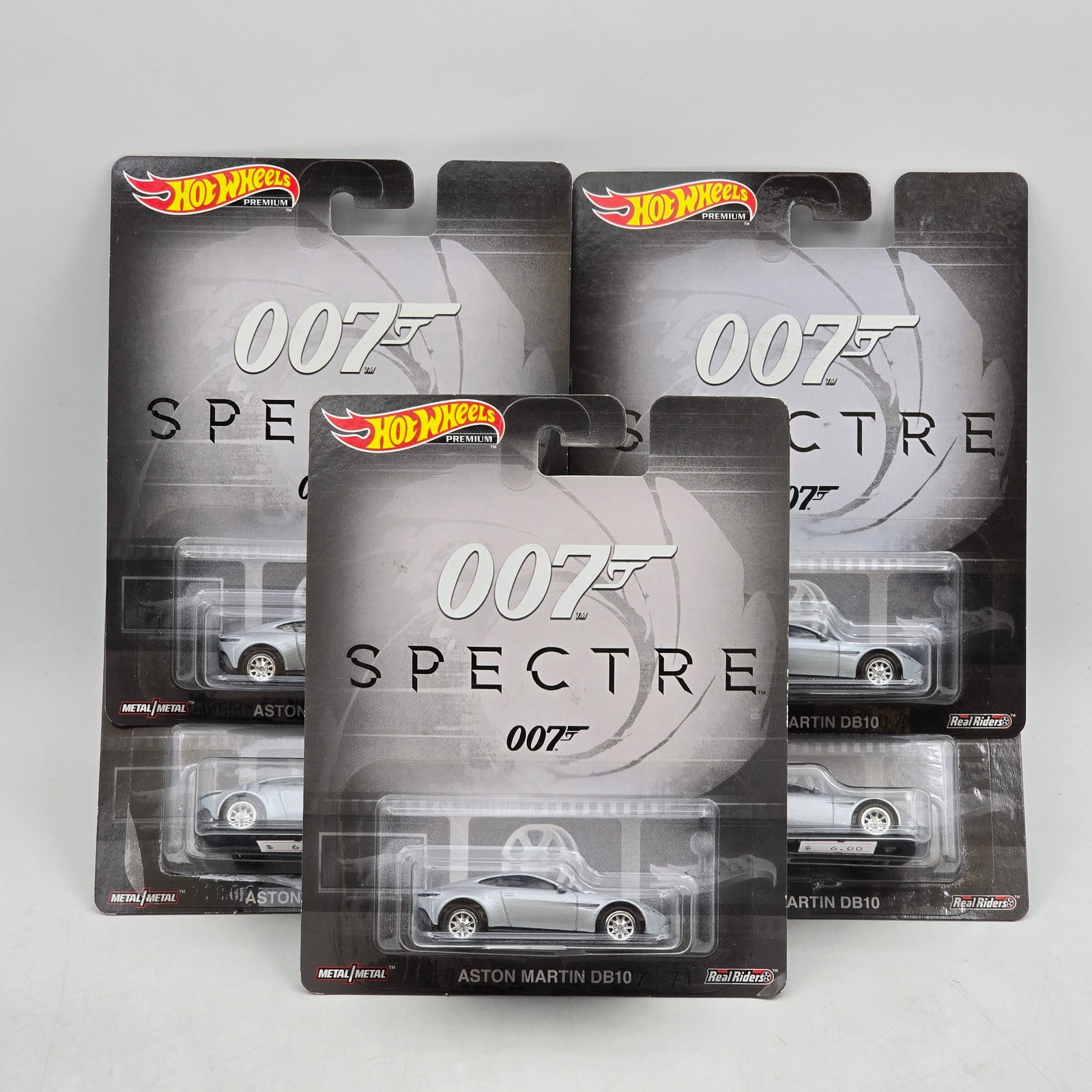 Lot of 5 Hot Wheels James Bond 007 Premiums: Includes (5) Aston Martin DB10 premium models from the James Bond 007 Spectre series. Cars-Look to be in good condition with no notable wear visible. Paint, tampos, glass, base and Real Riders wheels 