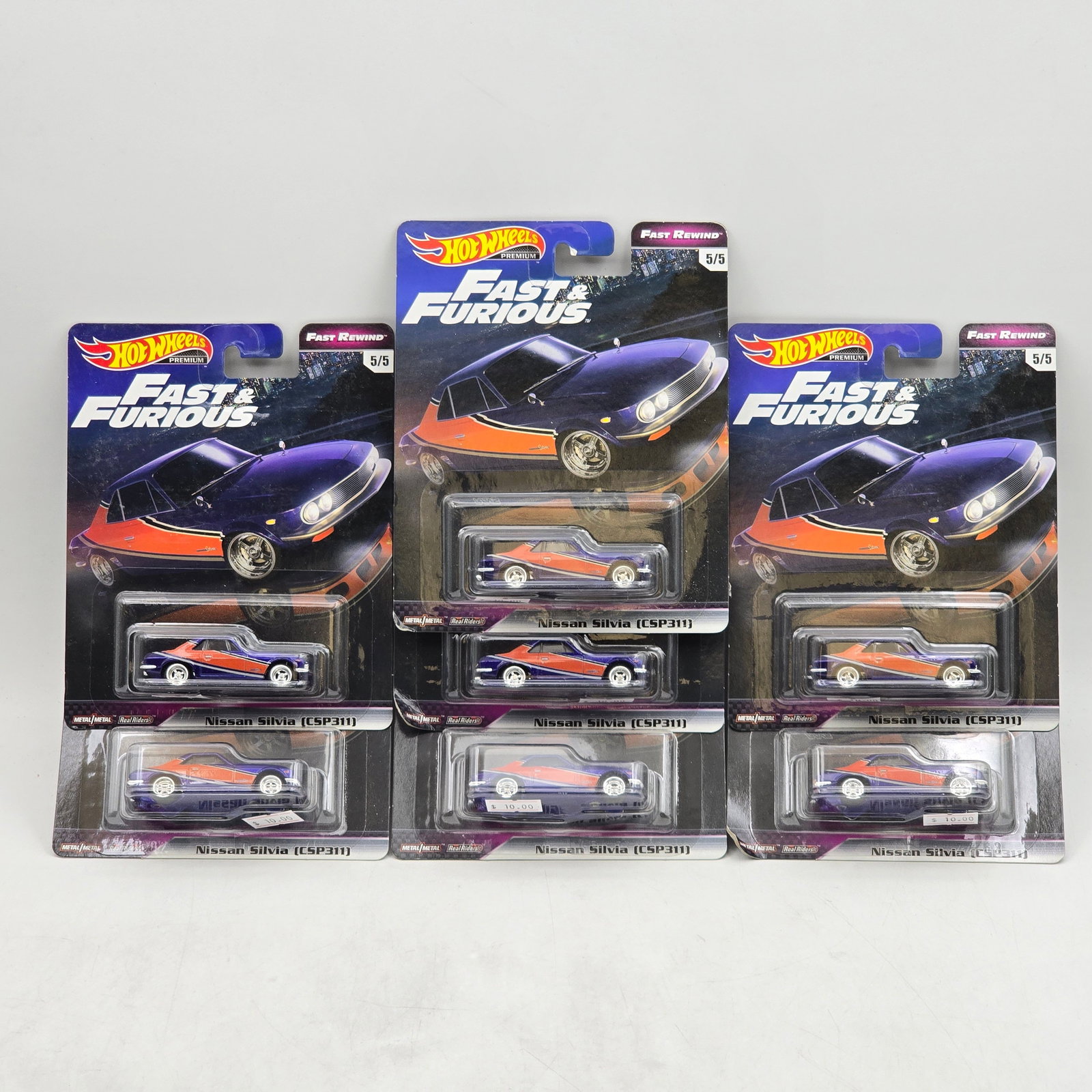 Lot of 7 Hot Wheels Fast & Furious Premiums: Includes (7) Nissan Silvia (CSP311) premium models from the Fast & Furious Fast Rewind series. Cars-Look to be in good condition with no notable wear visible. Paint, tampos, glass, base and Real R