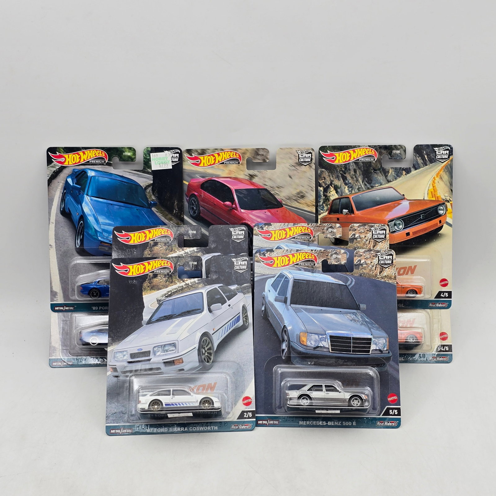 Lot of 10 Hot Wheels Canyon Warriors Premiums: Includes two complete Canyon Warriors 5-car premium sets featuring BMW M5, Ford Sierra Cosworth, Porsche 944 Turbo, â€™73 Volvo 142 GL, and Mercedes-Benz 500 E models. Cars-Appear to be in goo