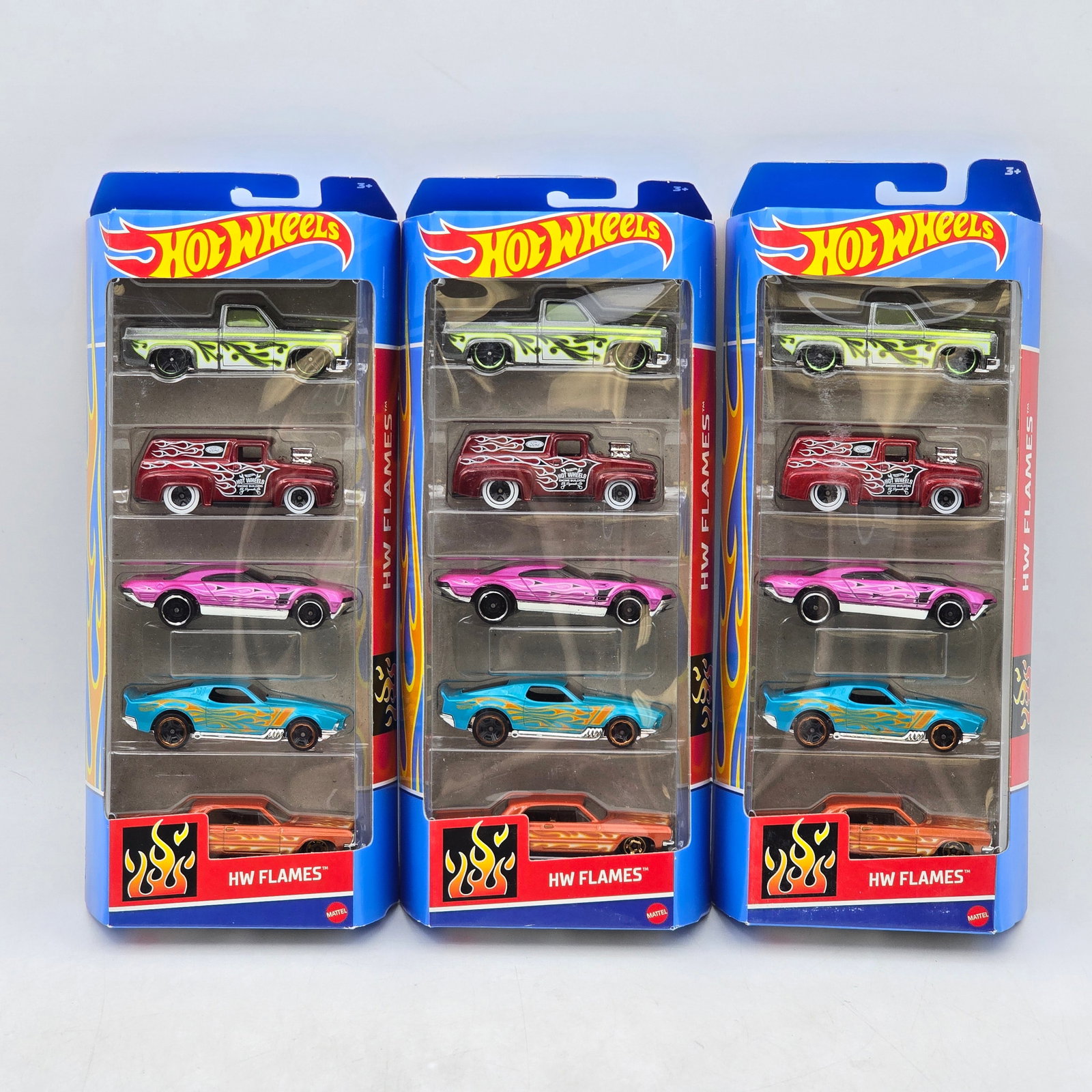 Lot of 3 Hot Wheels HW Flames 5-Packs: Includes (3) Hot Wheels HW Flames 5-pack sets featuring a mix of flame-themed custom cars, trucks, and muscle car castings. Vehicles-Look to be in good condition with bright paint, flame graphics, and