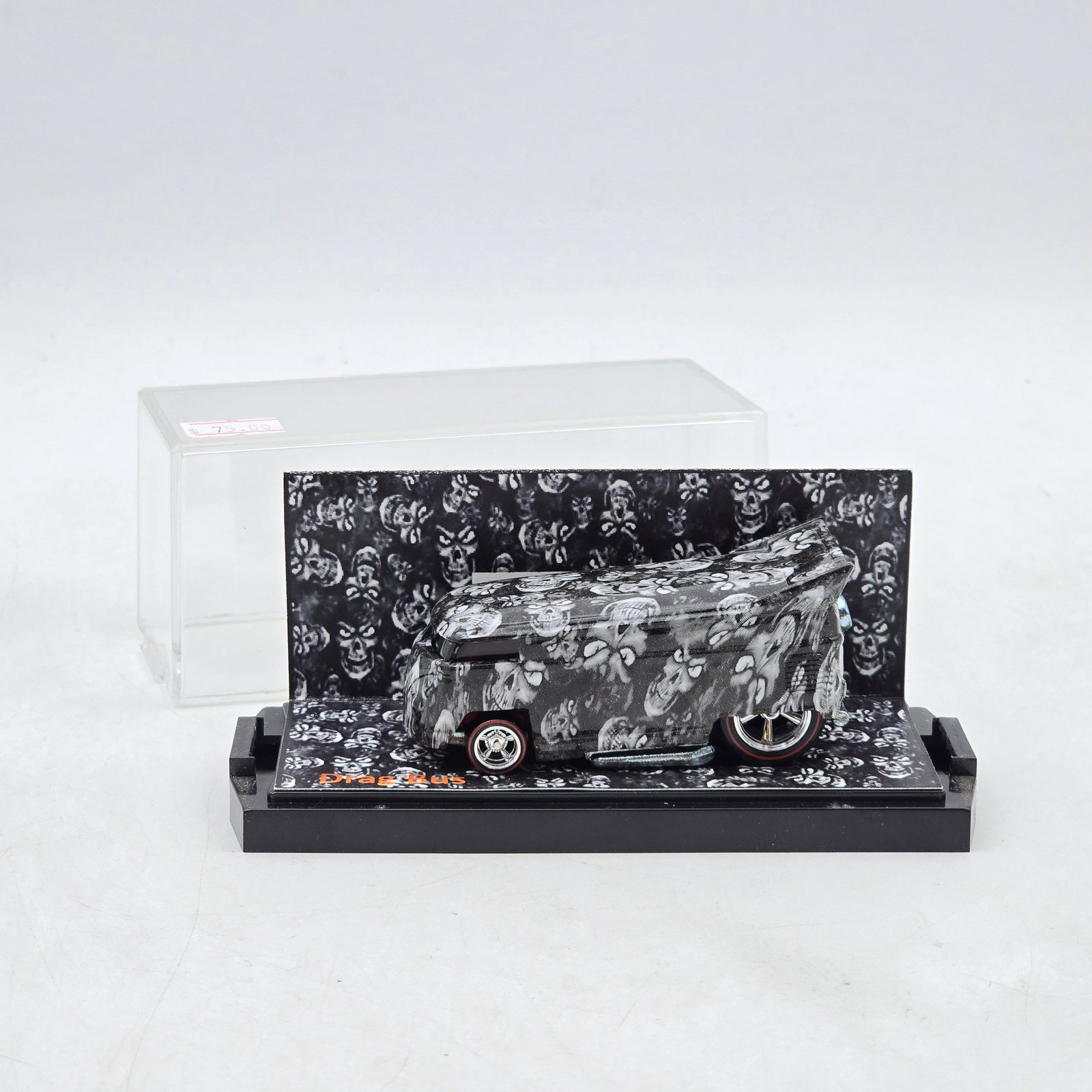 Hexman Kustoms Skullriders Series 2 Custom Drag Bus: Custom Volkswagen-style Drag Bus from the 2013 Hexman Kustoms Skullriders Series 2 featuring skull-pattern graphics, custom wheels, and themed display base. Vehicle-Looks to be in good condition with
