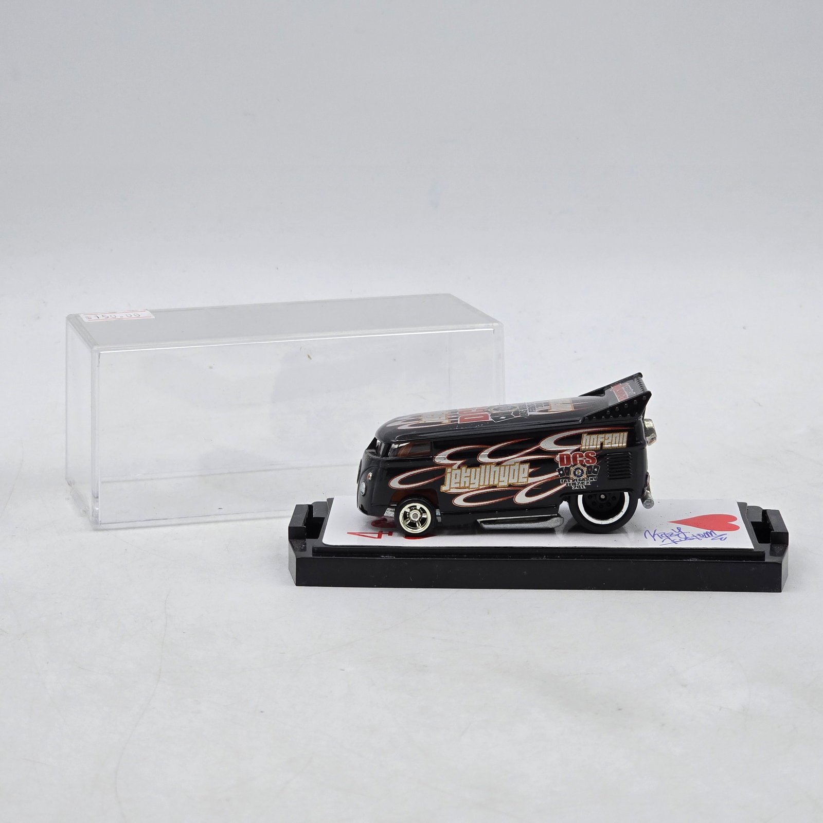 Signed Jekyll & Hyde VW Drag Bus Custom: Custom Volkswagen-style Drag Bus featuring black paint, flame graphics, and â€?Jekyll & Hydeâ€? custom lettering designed by Kazy Kustom Graphics. Includes Las Vegas 2011 event