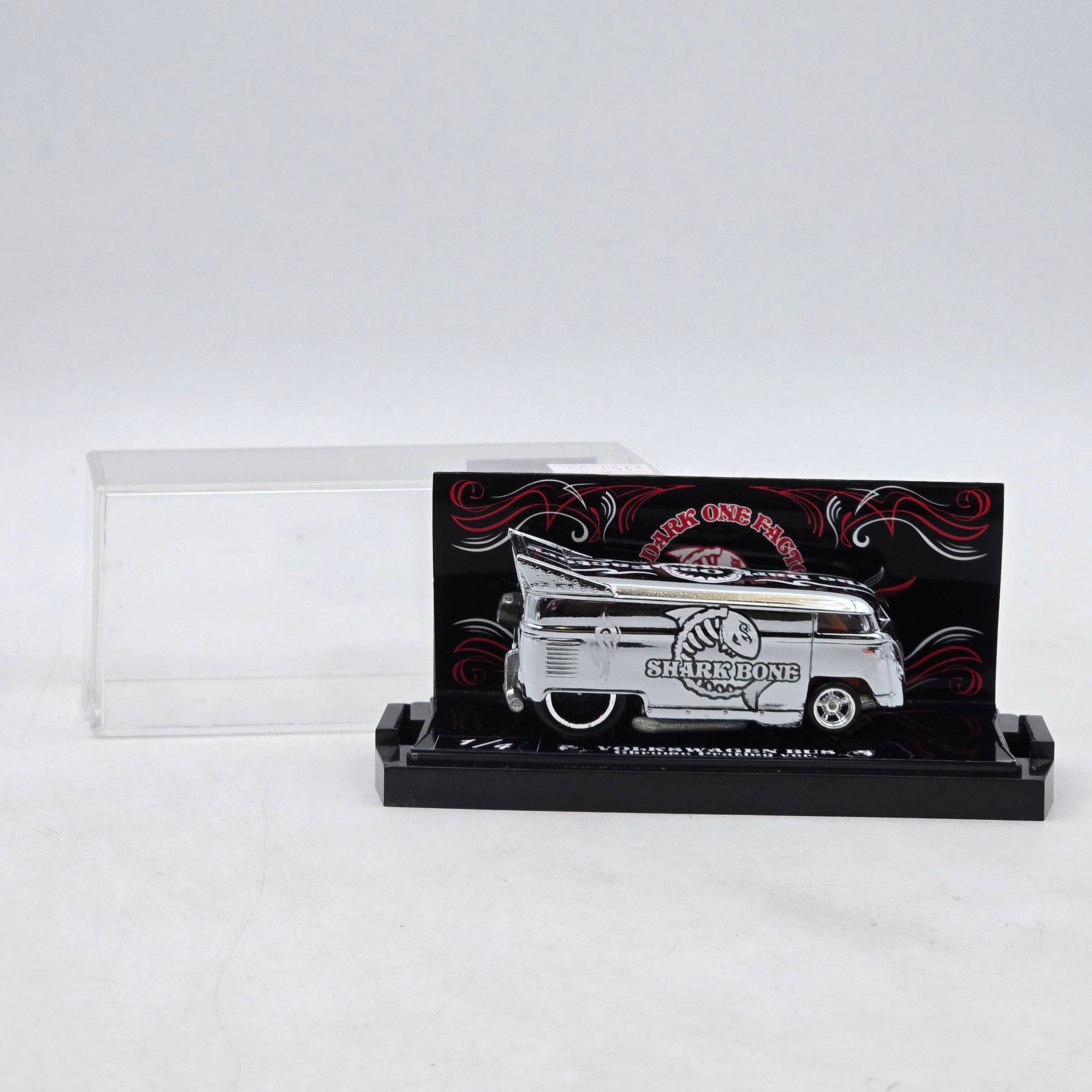Custom SharkBone Volkswagen Bus: Custom Volkswagen Bus featuring reflective chrome-style finish, SharkBone graphics, raised drag-style rear wing, and detailed custom pinstriping. Display is marked 1/4 and includes themed Dark One