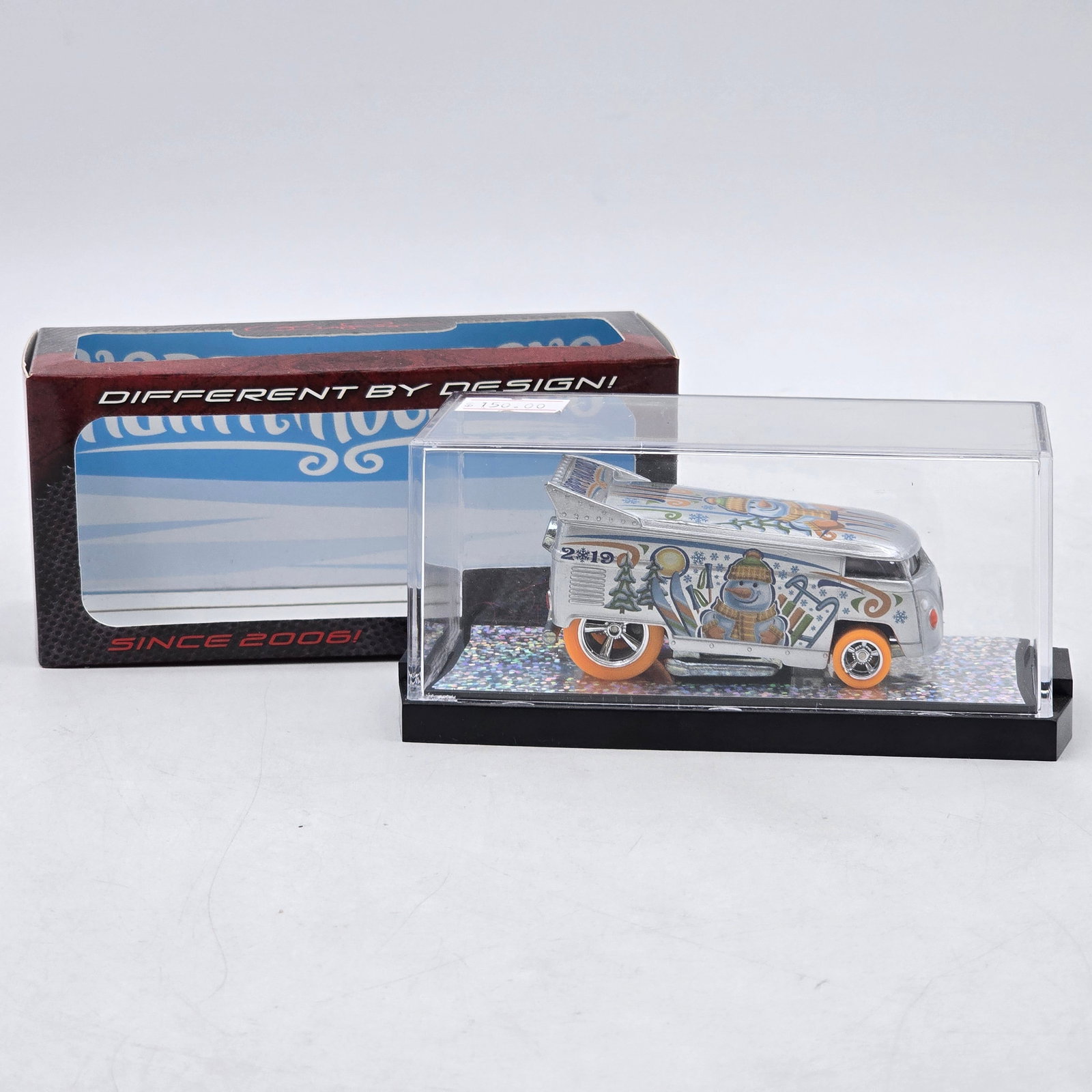 Pope Designs Happy Holidays VW Drag Bus: Custom Volkswagen-style Drag Bus by Pope Designs featuring reflective silver finish, holiday-themed â€?Happy Holidaysâ€? graphics, snowman artwork, and raised drag-style rear wing. Individ
