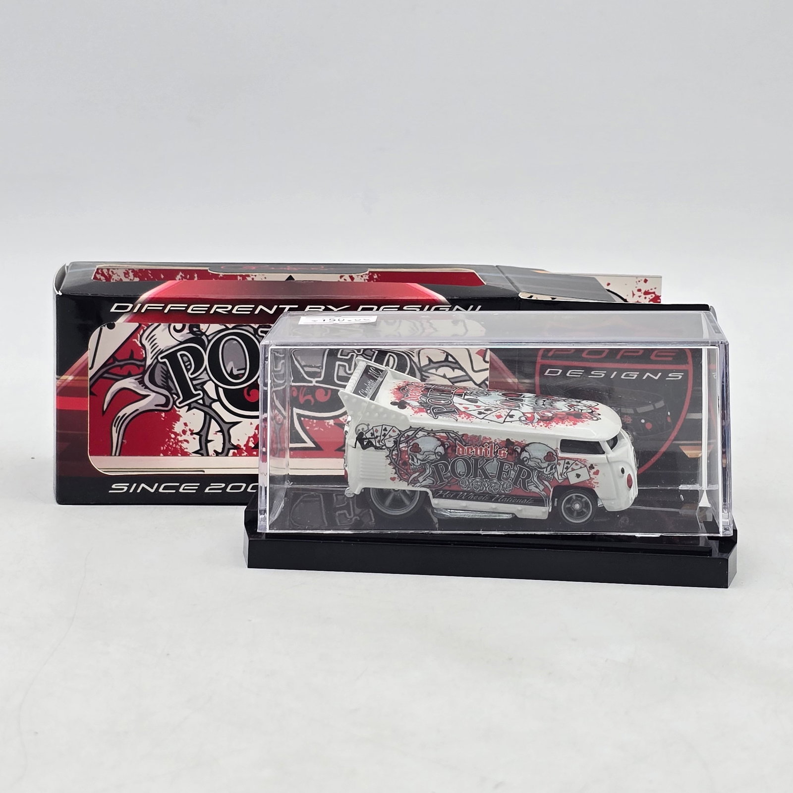 Pope Designs Devilâ€™s Poker VW Drag Bus: Custom Volkswagen-style Drag Bus by Pope Designs featuring â€?Devilâ€™s Pokerâ€? graphics with skull, playing card, and casino-inspired artwork in a bold white, red, and black colo