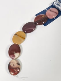 Group of Red Marble Oval Beads