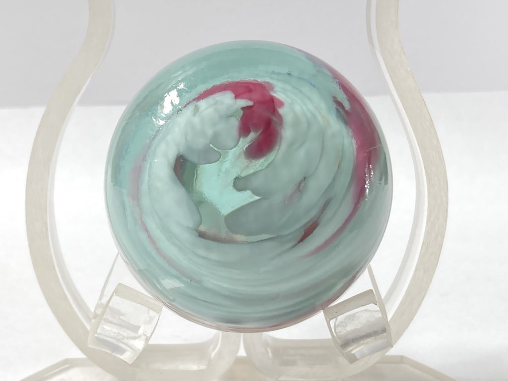 Unmarked White/Pink Swirl Glass Paperweight: Unmarked White/Pink Swirl Glass Paperweight, 1 3/8in by 2.25in