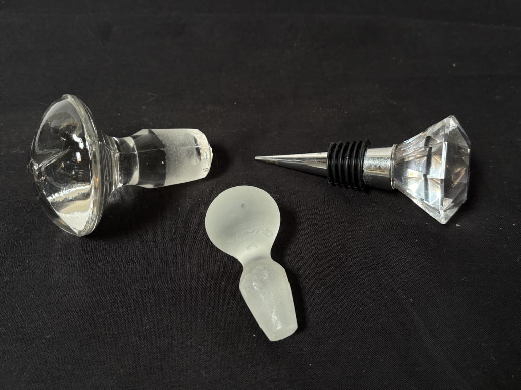 Group of Glass Stoppers: Group of Glass Stoppers, 3.75in by 2.25in