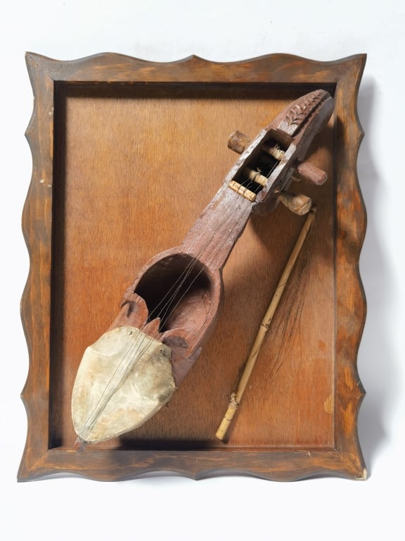 Decorative Hand-Carved Folk String Instrument: Decorative Hand-Carved Folk String Instrument with Bow, 19in by 16in