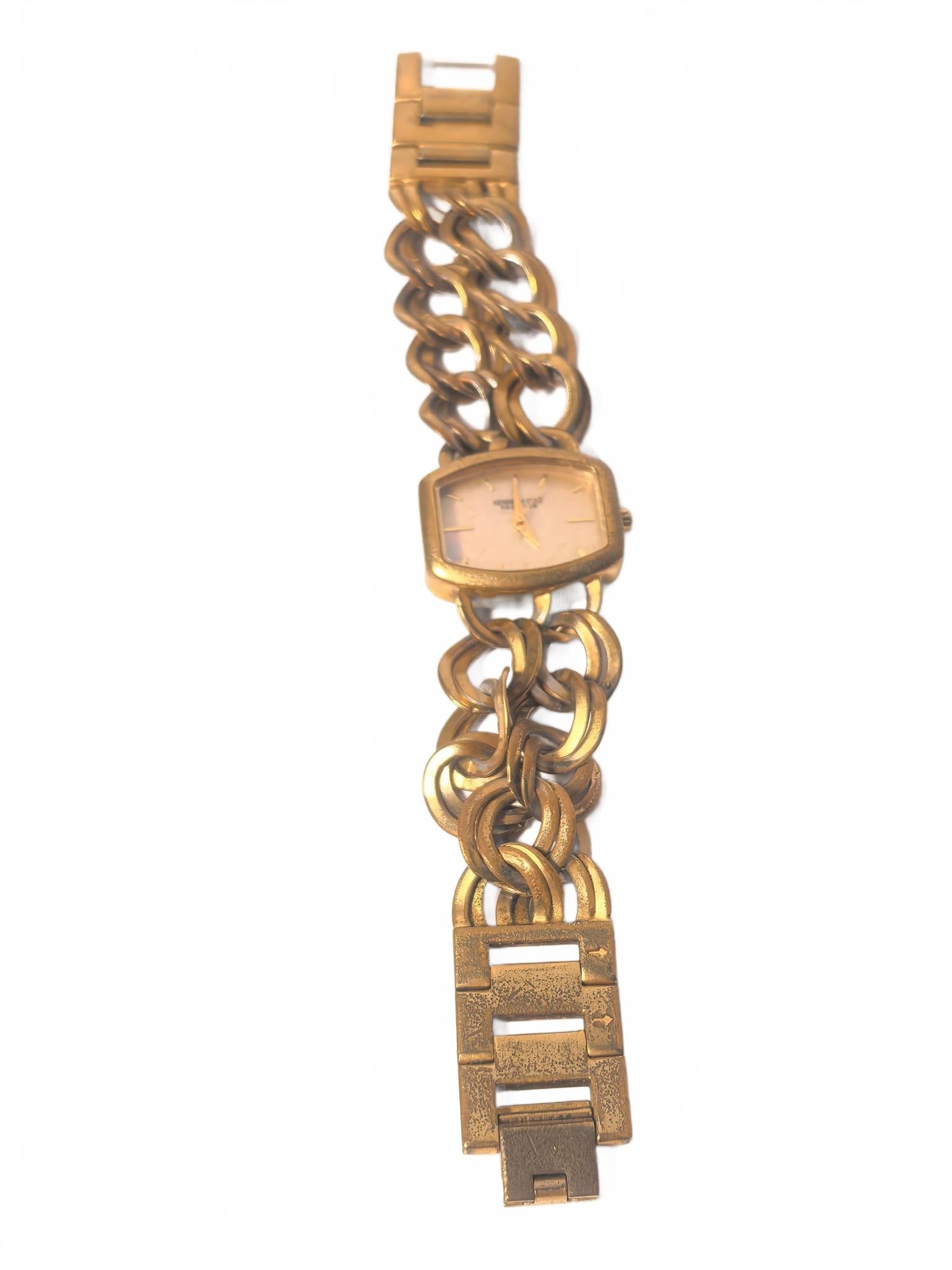 Kenneth Cole Reaction Gold Link Watch: Kenneth Cole Reaction wristwatch featuring a gold-tone large circular link bracelet, rectangular face, and stainless steel back. Water resistant with Japan movement. Model KC4569S301-06. 6.5in