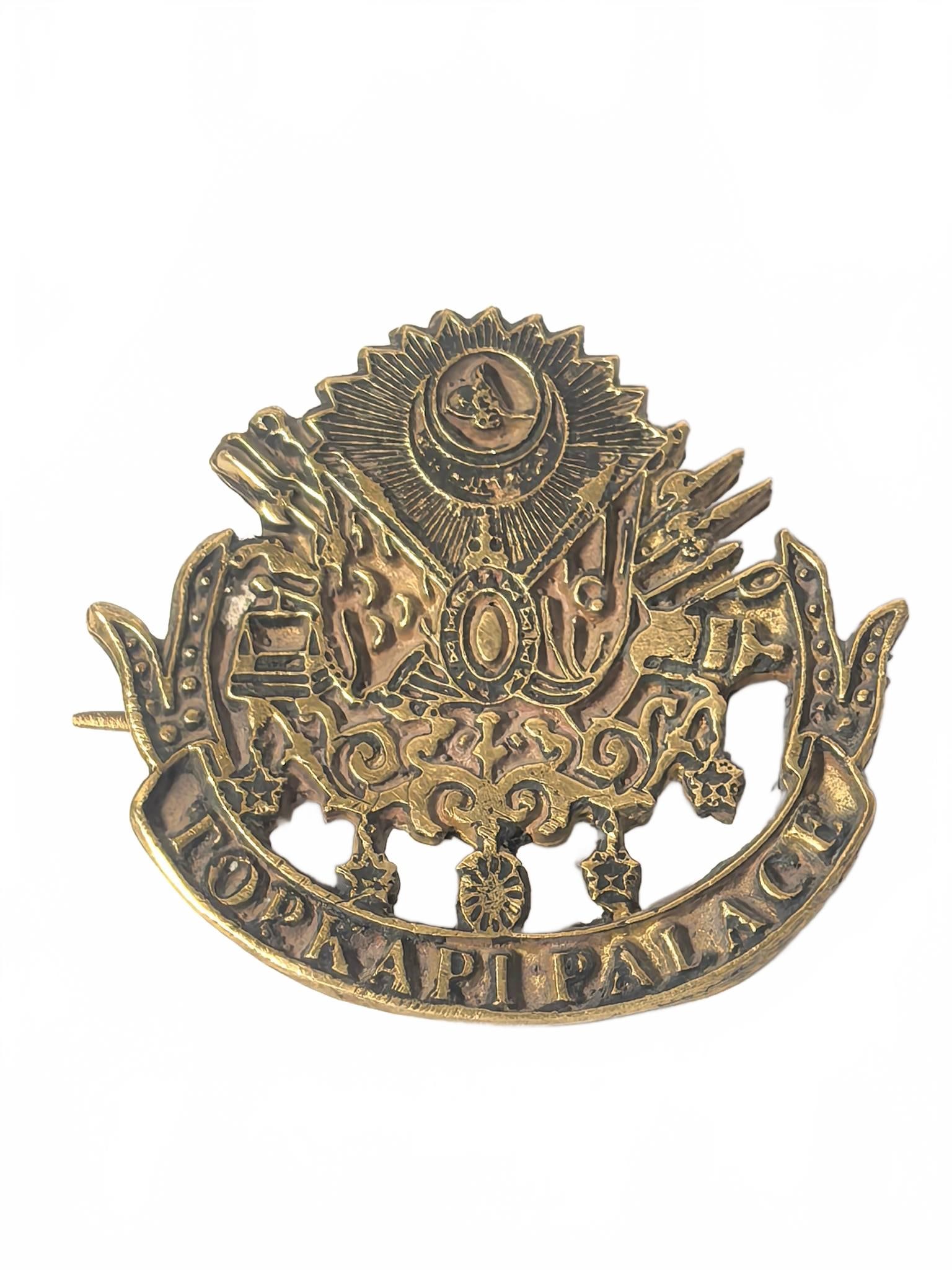 Topkapi Palace Brass Pin Badge: Brass pin badge featuring Topkapi Palace and Ottoman motifs with hinged clasp back. 1.5in