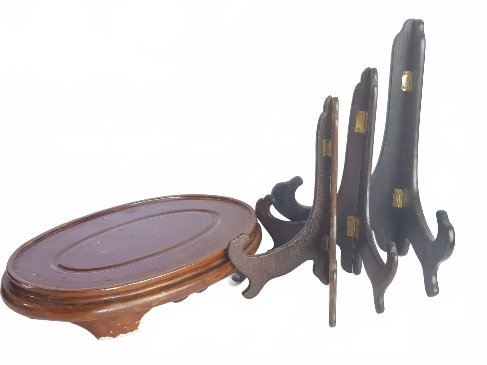Wood Display Stands and Pedestal Base: Group includes three wood easel-style display stands and one oval wood pedestal base. 13.5in by 12in by 8.5in