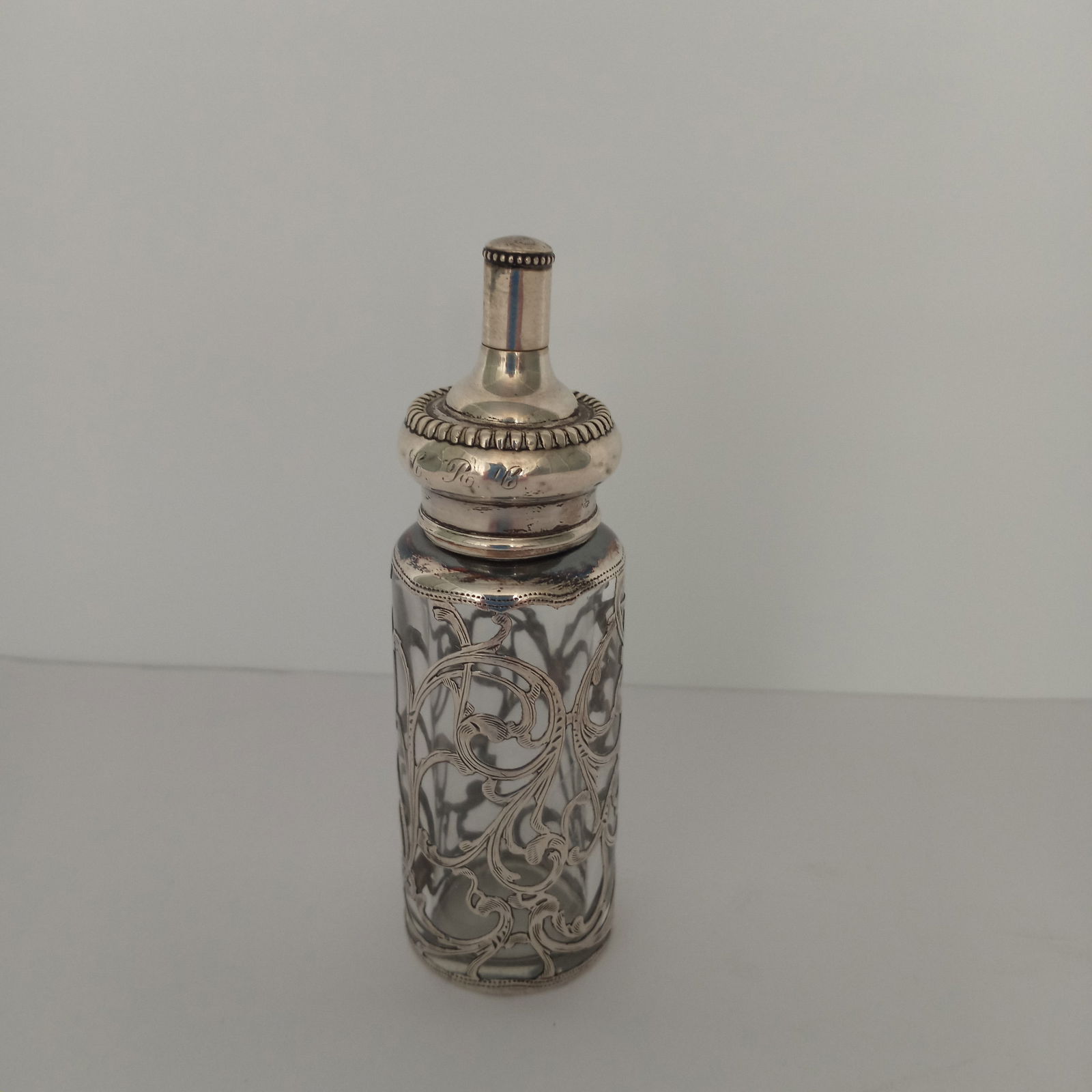 Sterling Silver La Pierre Ladies Hunting Flask - Crystal Bottle Signed: Stunning Rare La Pierre Sterling Silver Overlay Antique Bottle circa 1800s - measuring approx. 4 1/2" H x 1 1/4" D. It is a lady's hunting flask, or a glove powder bottle. There is an opening on the t