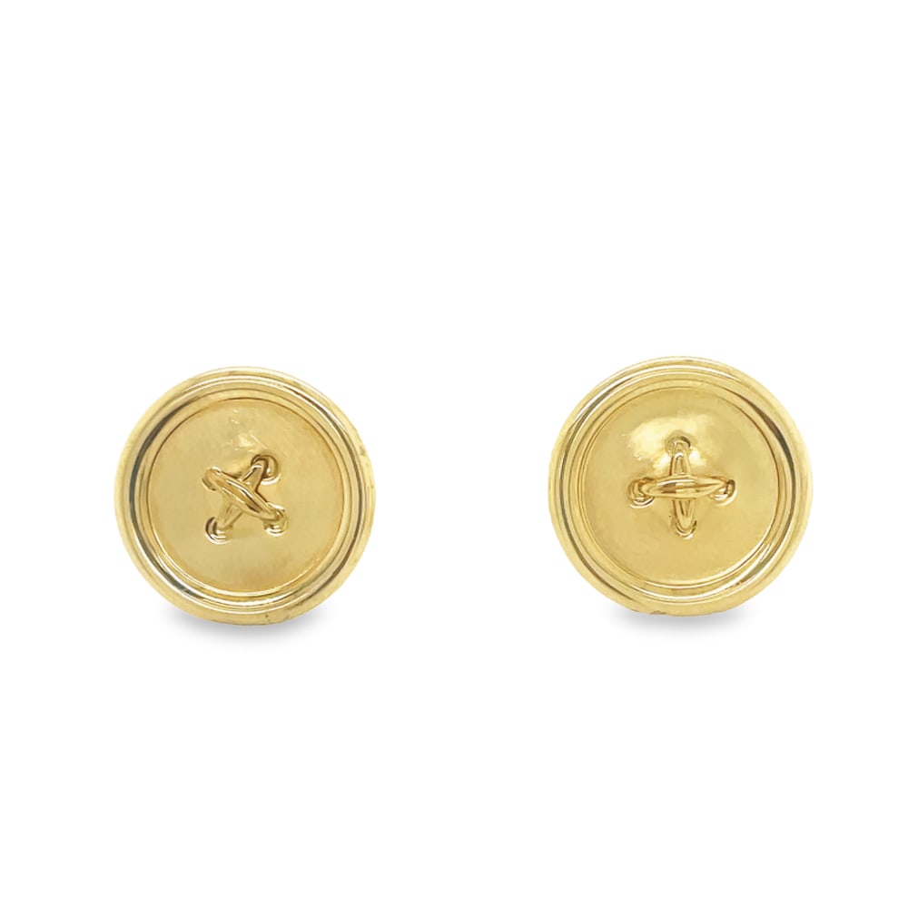 Tiffany & Co. 14k Yellow Gold Button Set: Designer: Tiffany & Co. Metal type: 14k yellow gold Set of 7 buttons Gold "threads" across center of buttons Three large (approx. 19mm wide); four small (approx. 15mm wide) Comes with Tiffany & Co. si