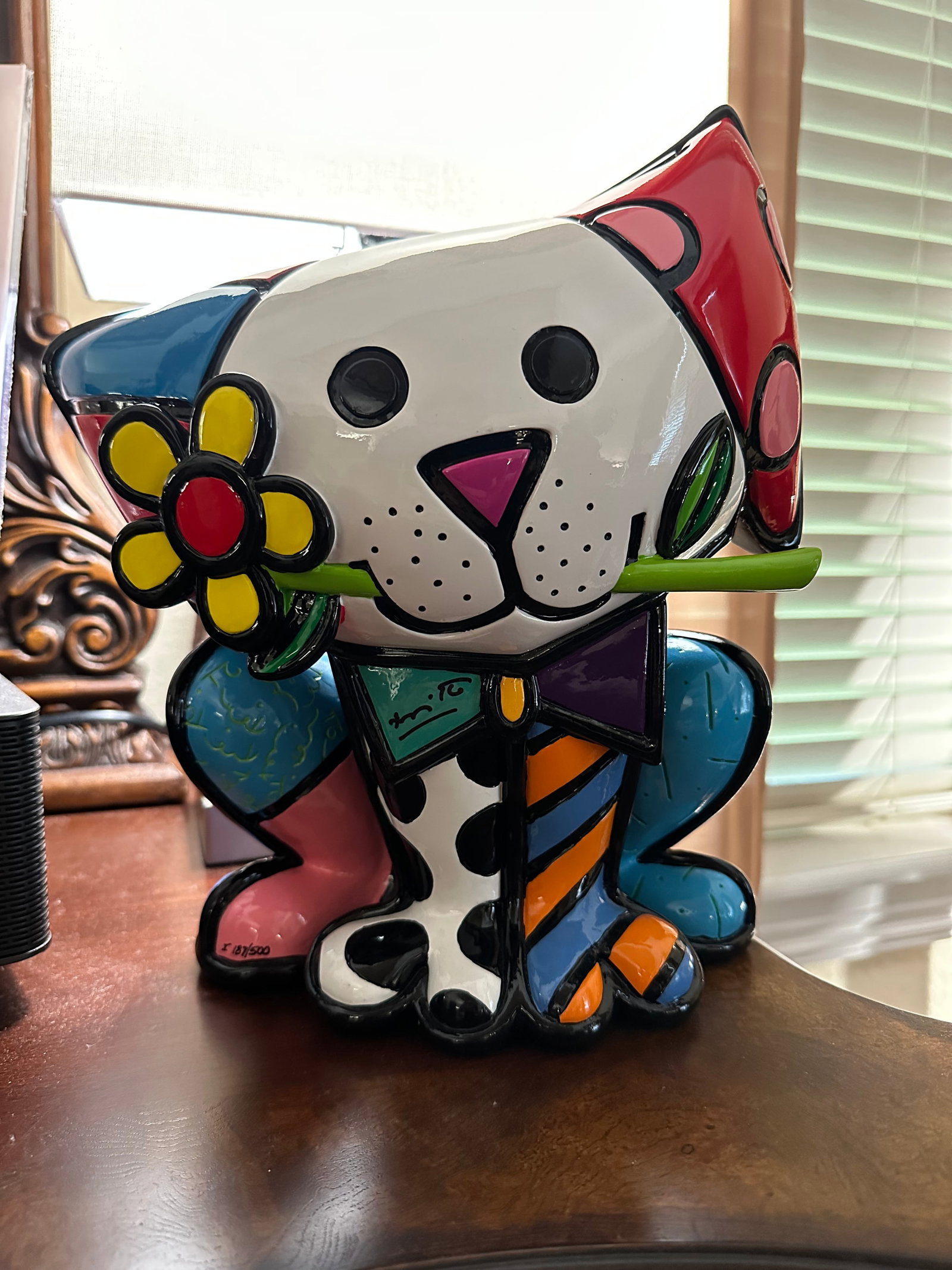 Romero Britto Yellow Flower: Romero Britto "Yellow Flower" 2019 12" x 10 1/2" Hand painted sculpture, handcrafted in resin. Hand-signed in pigment on the bow tie by the artist. Gallery framed, COA, appraisal, JKM