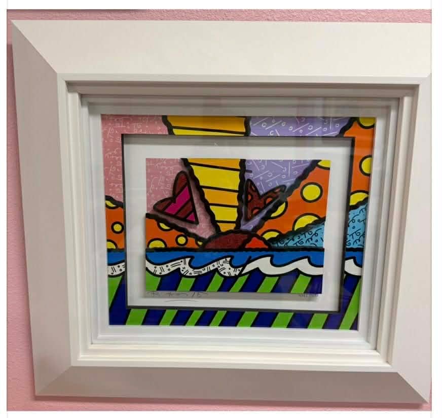 Romero Britto Heart Sunrise: Romero Britto "Heart Sunrise" 2016 31" x 15 3/4" image size Three-dimensional serigraphy construction in color with cut-outs in serigraphy. Signed in pencil lower left by the artist. Gallery framed,